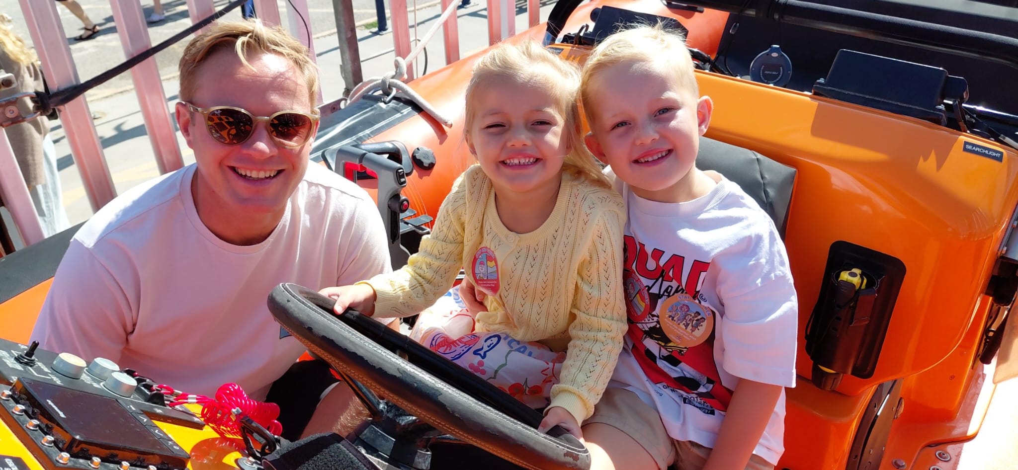 Andy Pearce and children Hannah, three and Charlie, five enjoying a visit to the Whitstable lifeboat during Emergency Day at Whitstable RNLI.