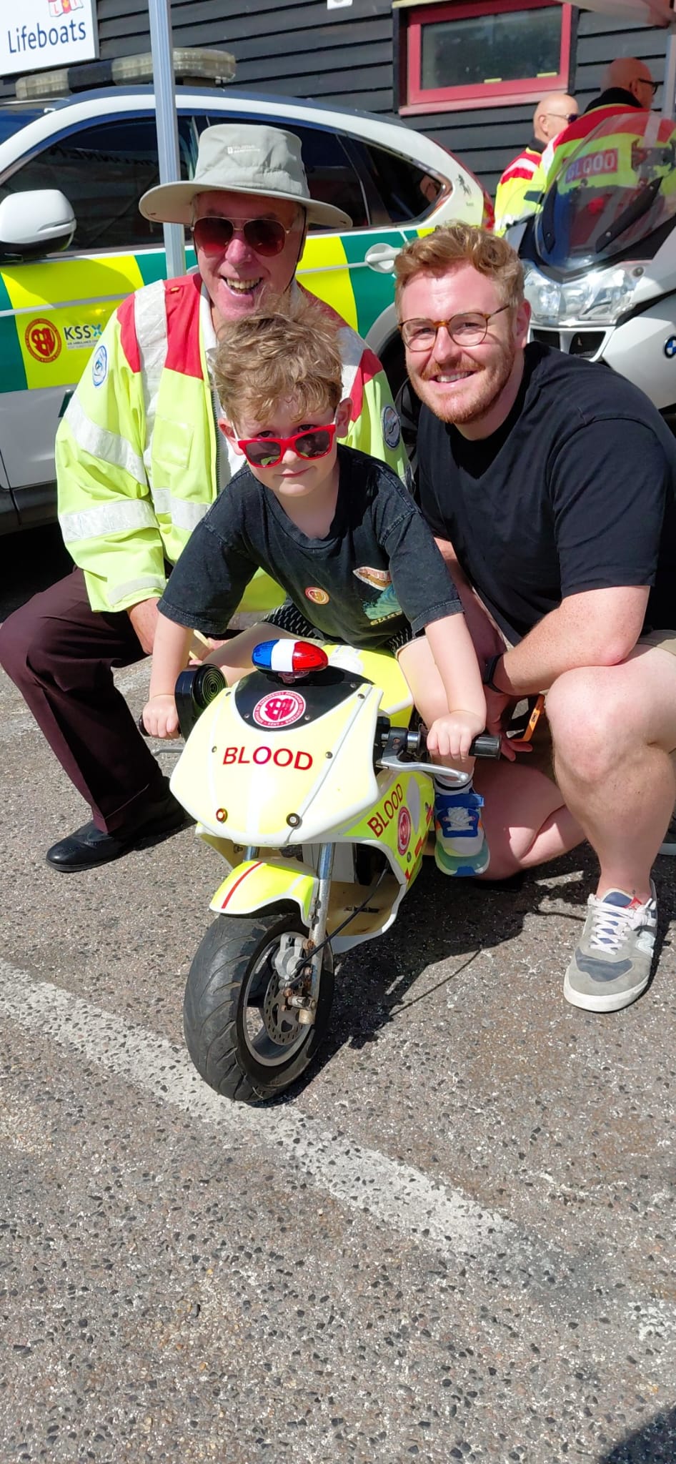 Trevor Sayer of Serv Kent Bloodrunners with Harry, five and his dad Tom Stott during Emergency Day at Whitstable RNLI.