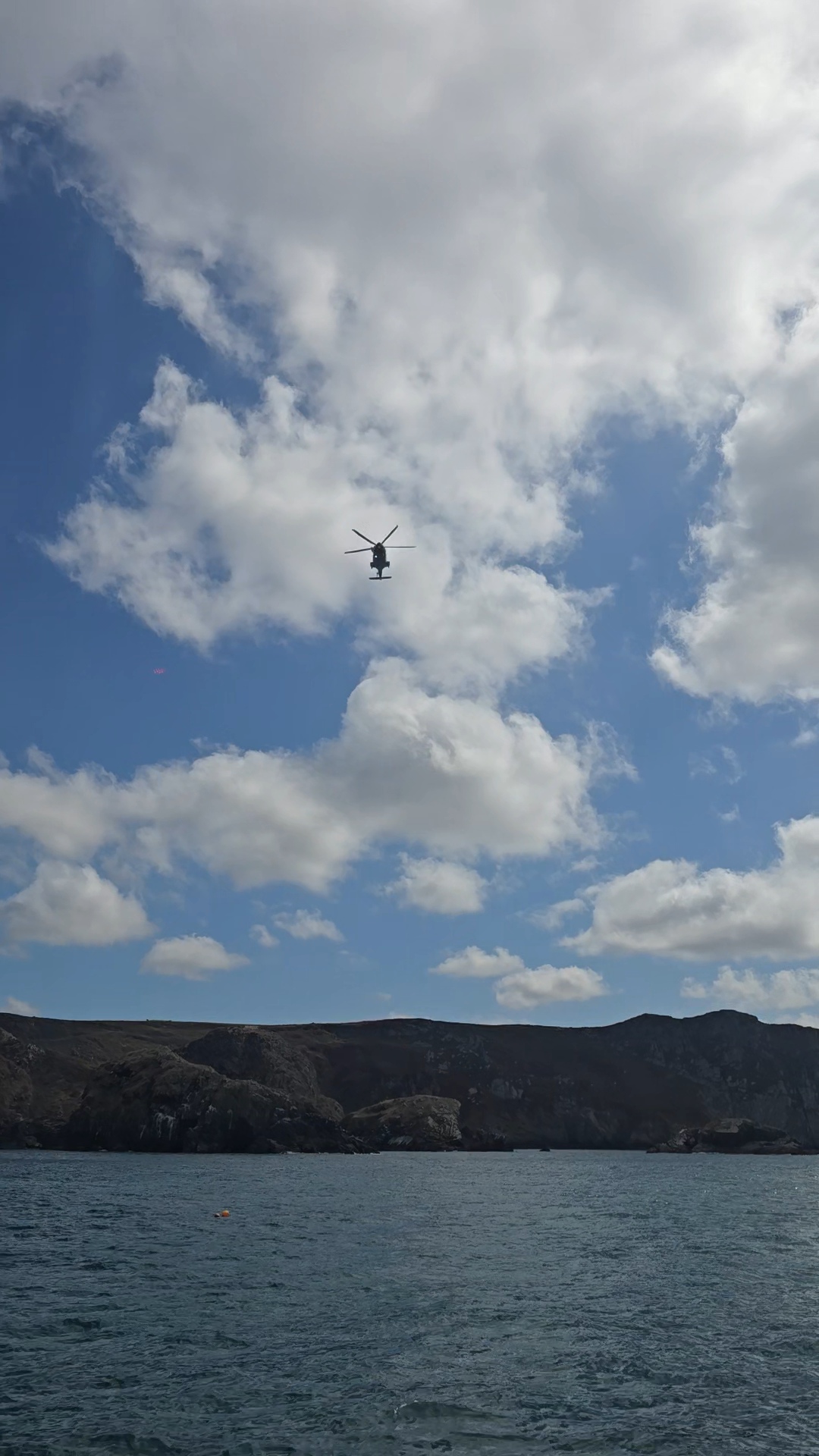 Coastguard helicopter over the ALB off Pwll Deri