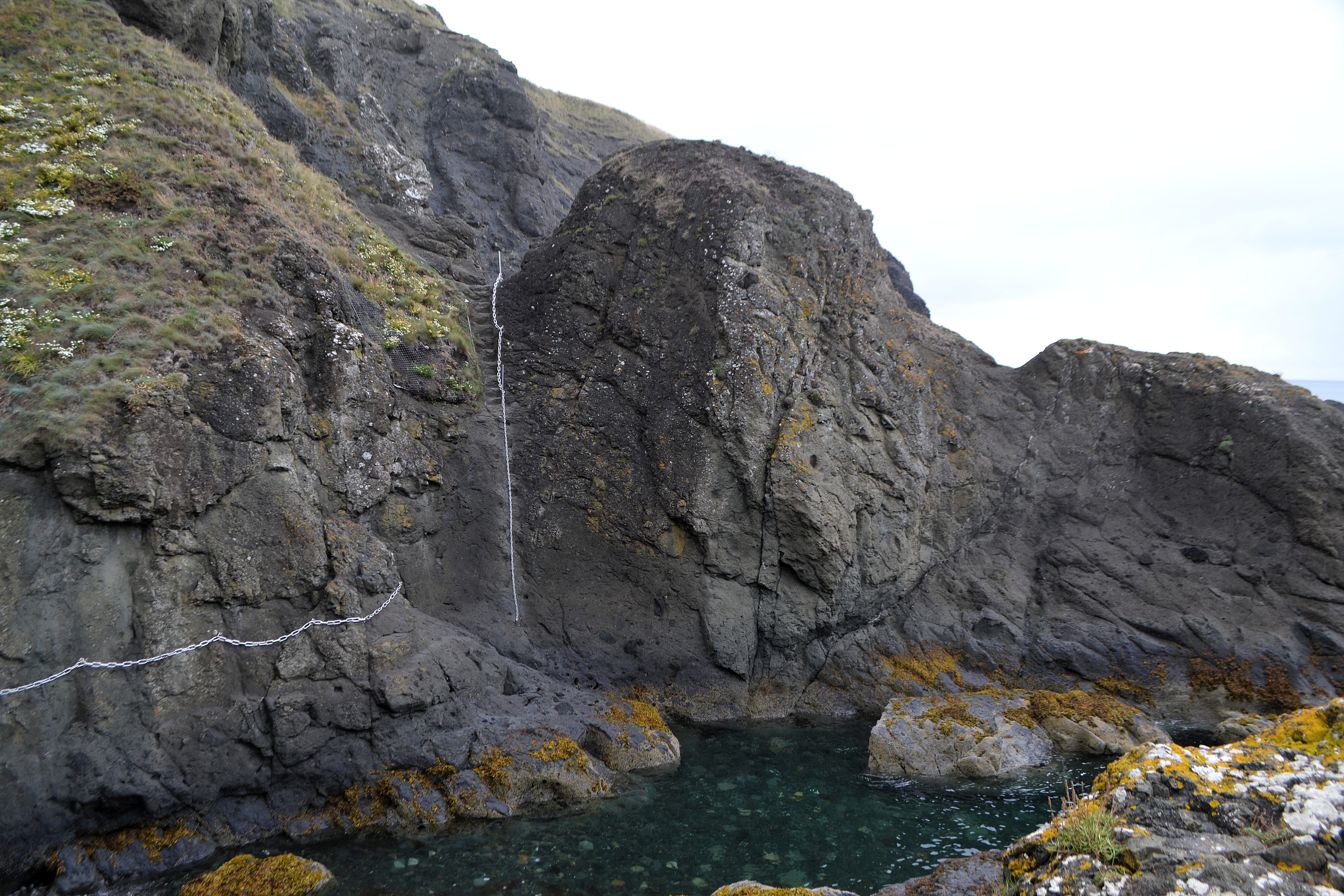 Chain walk with two chains - One vertical going up a cliff and one horizontal