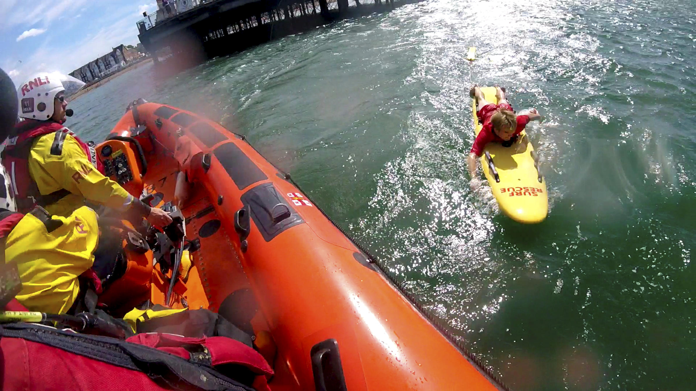 The Herne Bay Lifeguard comes alongside the lifeboat after assisting two paddle boards in difficulties under Herne Bay Pier on Friday.
