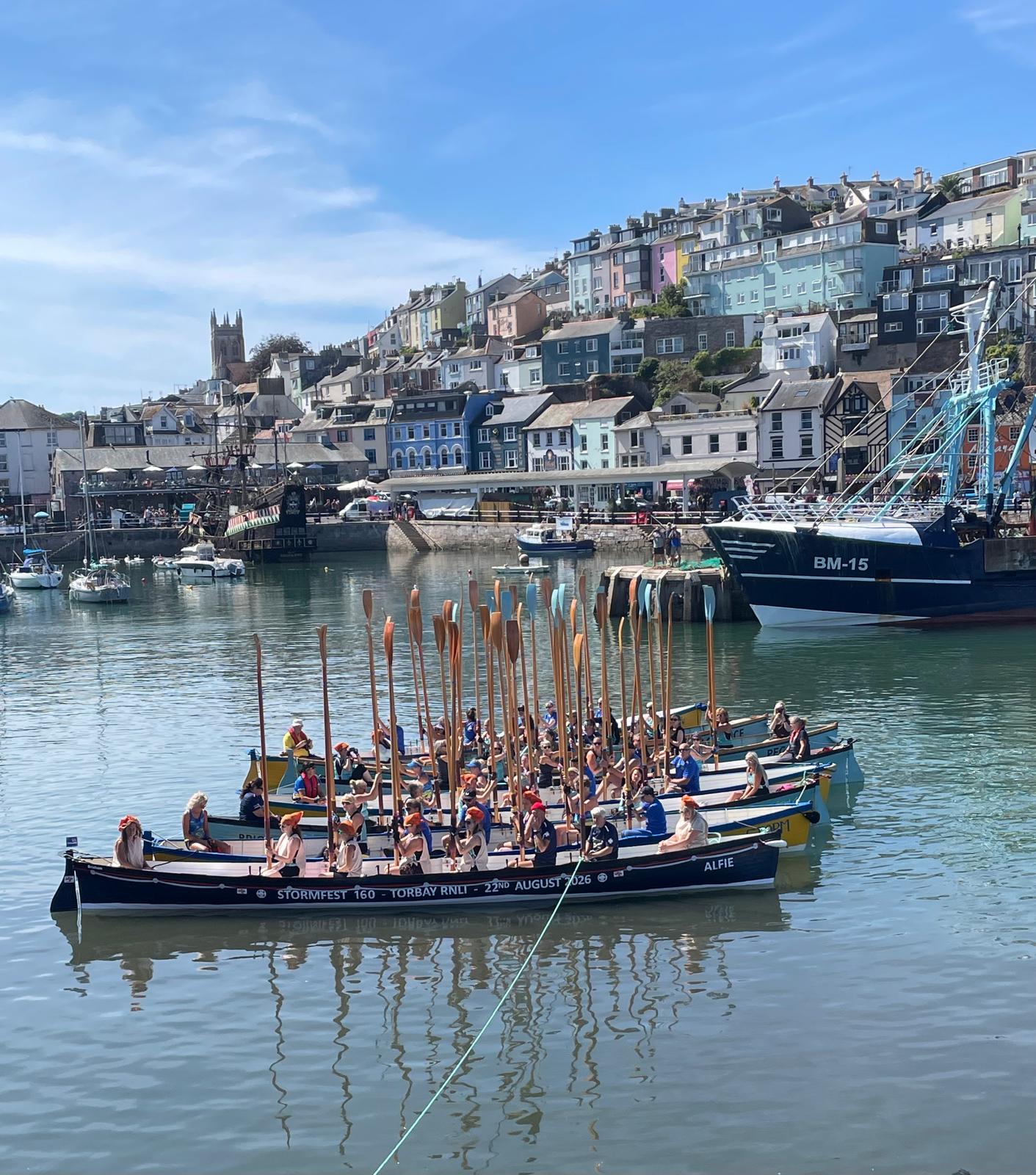 A salute from the gig boats in Brixhan Harbour