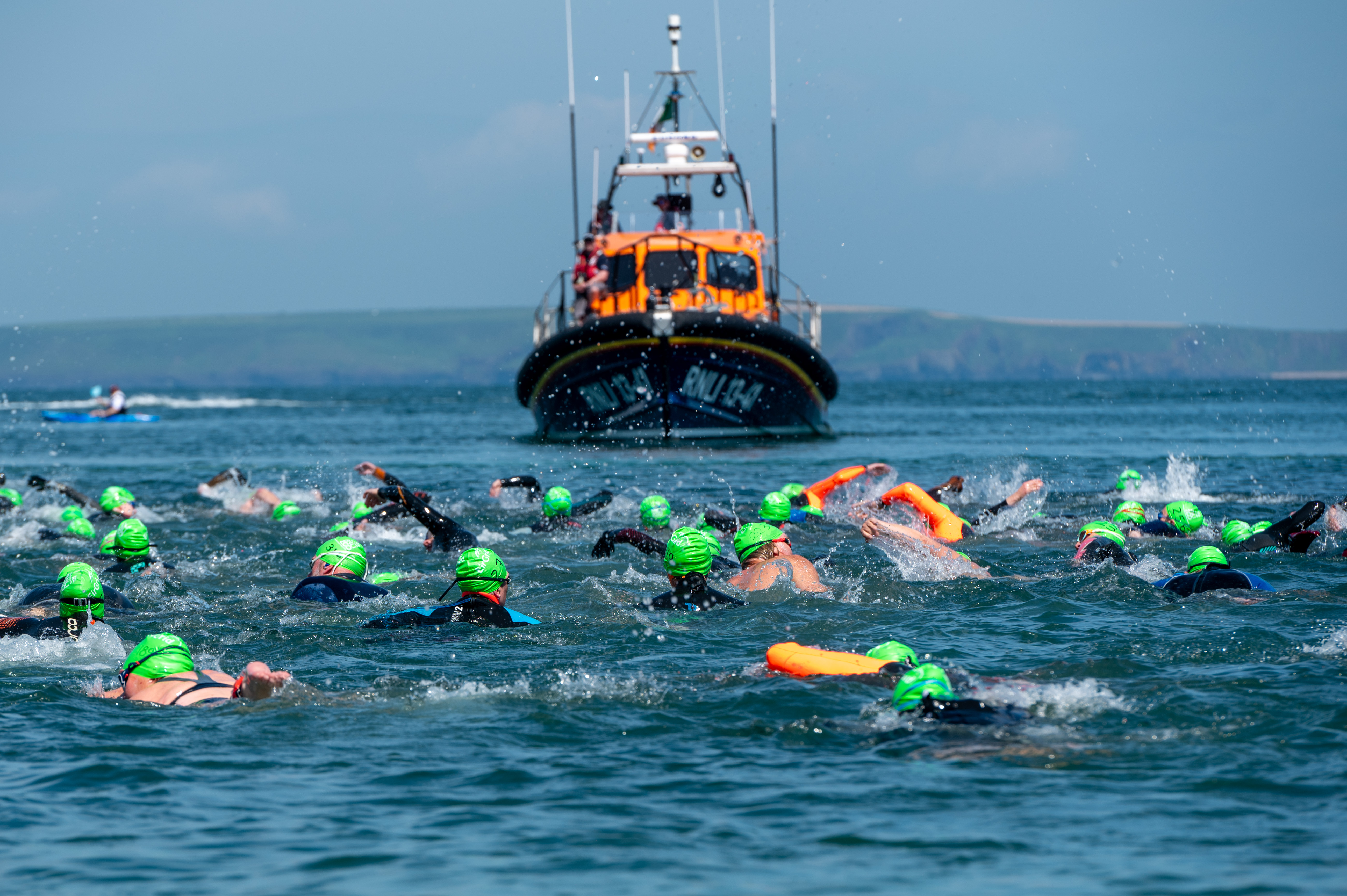 Dummore East RNLI Lifeboat with swimmers in the foreground.