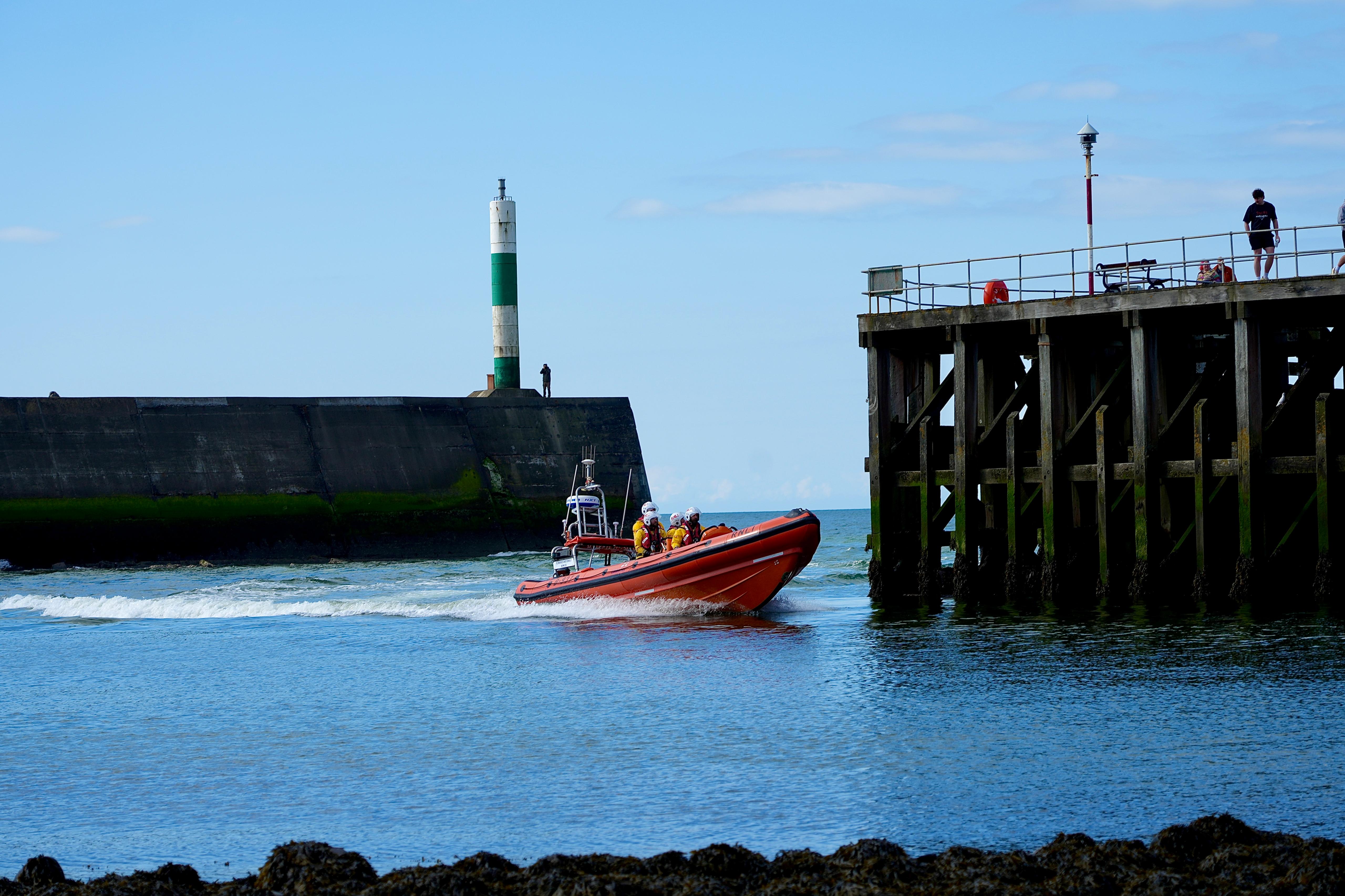 Atlantic 85 lifeboat coming into Aberystwyth Harbour on a sunny day. 
