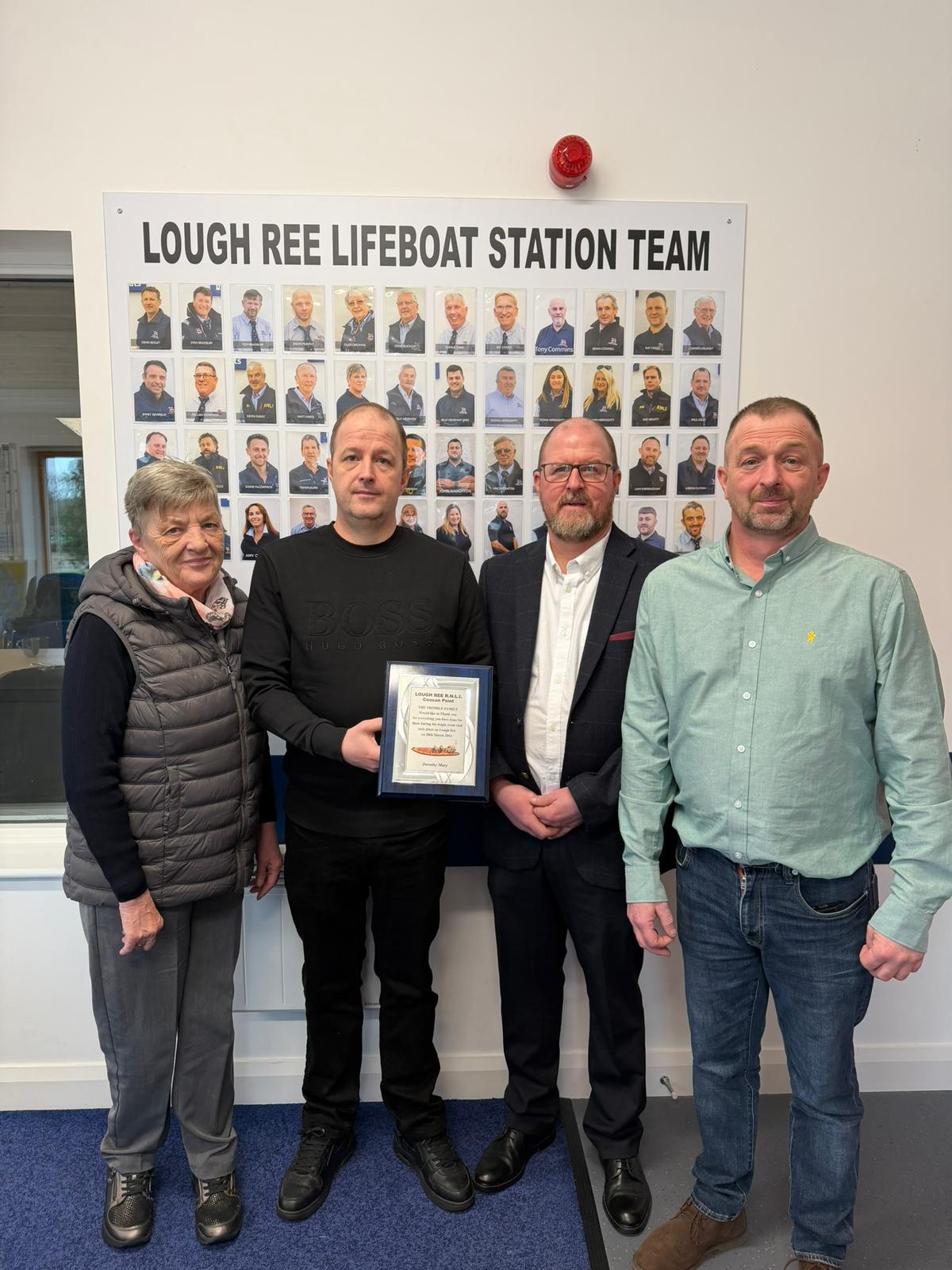 The family of the late John Trimble present a cheque for €1,840 to Lough Ree RNLI