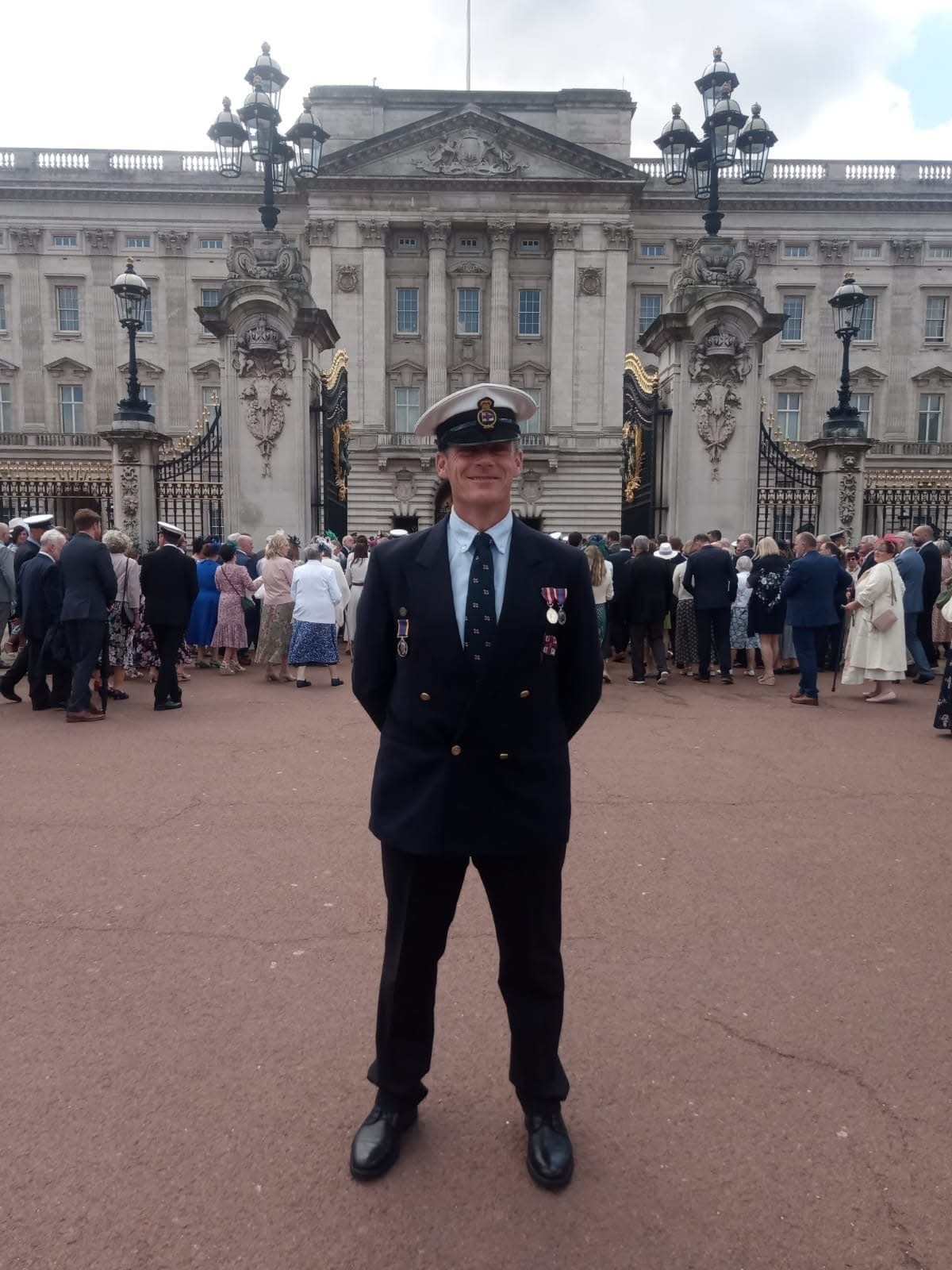 Wil Stockford standing outside of Buckingham Palace during celebrations for the 200th year of the RNLI