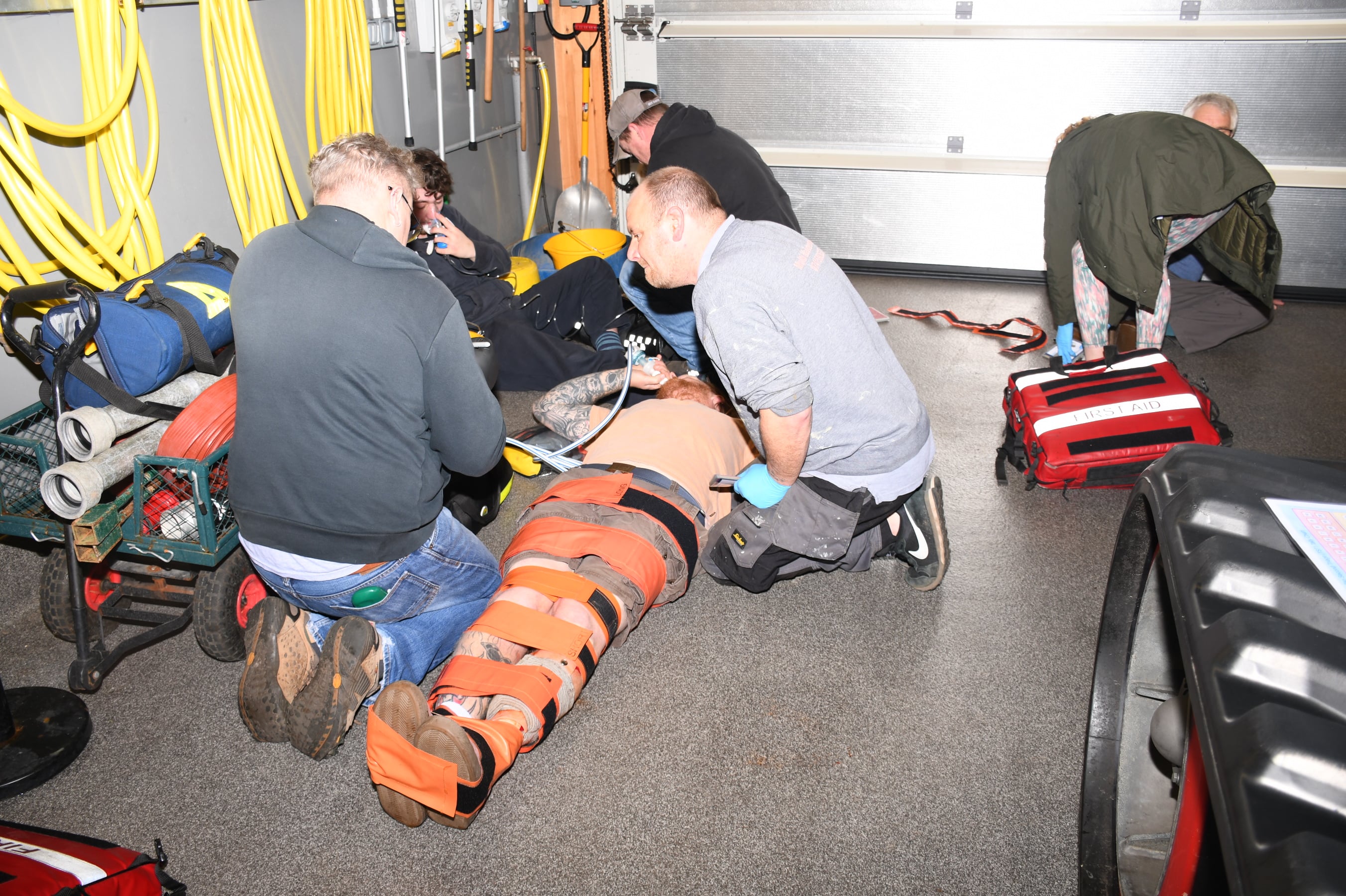 Wells RNLI volunteers have now successfully completed the RNLI’s intensive Casualty Care Course, delivered in two groups across the last two weeks. This training equips crew members with vital skills to support their lifesaving work at sea. Crew laid on the stion floor with other crew members providing simulated casualty care 
