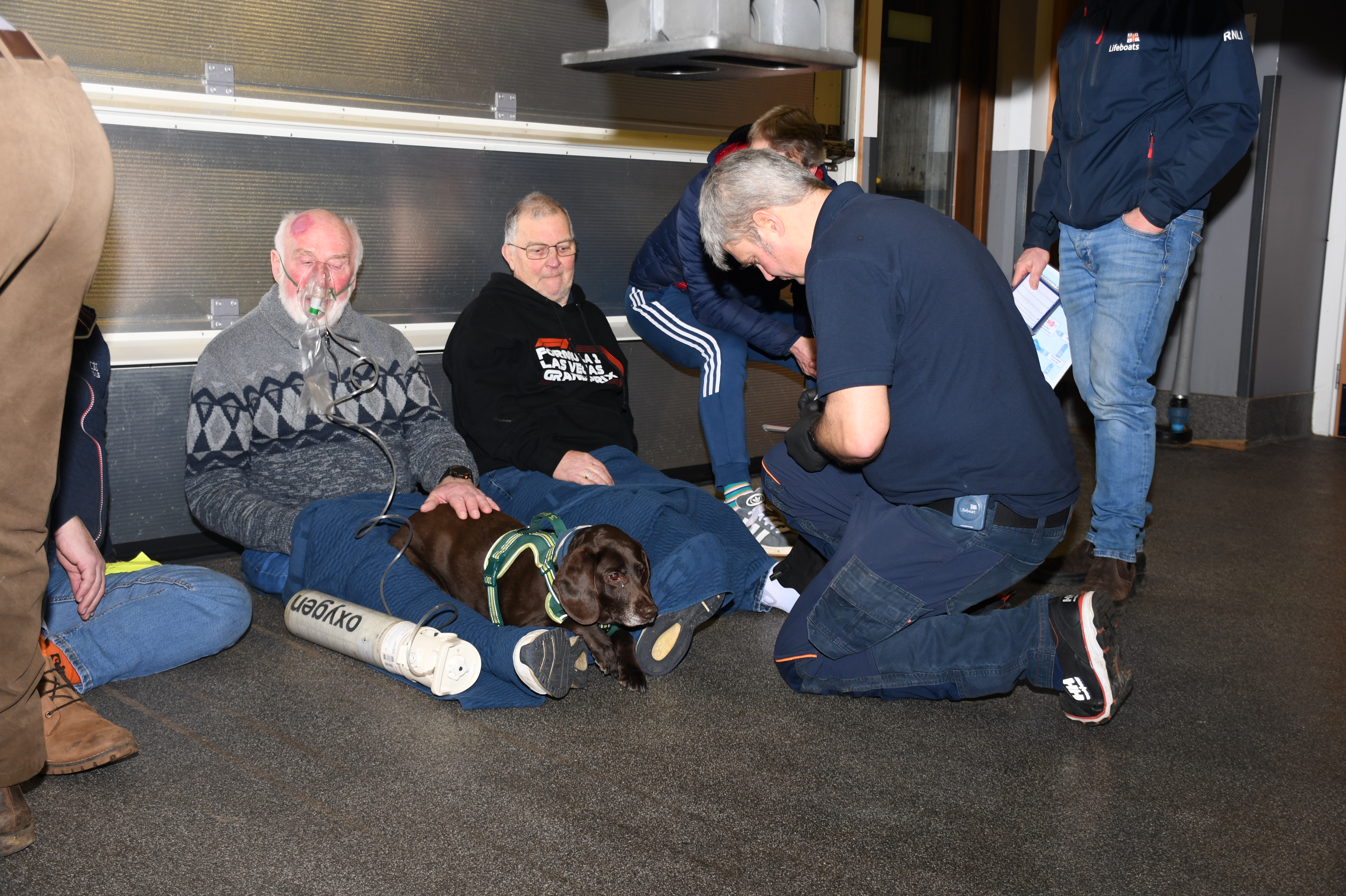 Wells RNLI volunteers have now successfully completed the RNLI’s intensive Casualty Care Course, delivered in two groups across the last two weeks. This training equips crew members with vital skills to support their lifesaving work at sea. Crew laid on the stion floor with other crew members providing simulated casualty care 