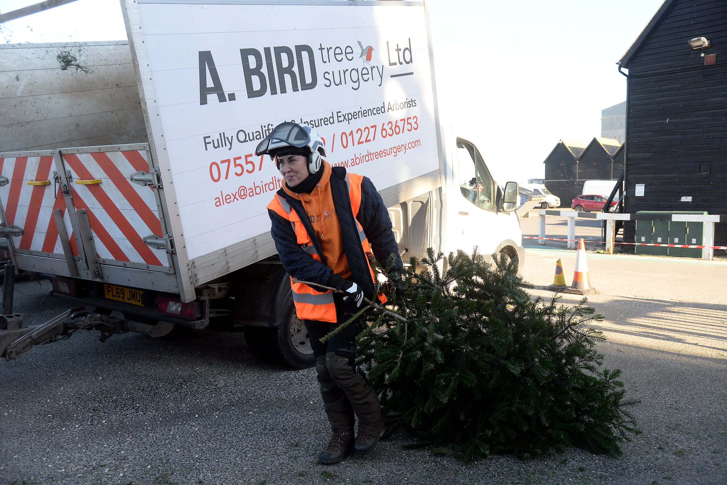 Tamsin Bird deals with a Christmas tree at Whitstable RNLI on Sunday.
