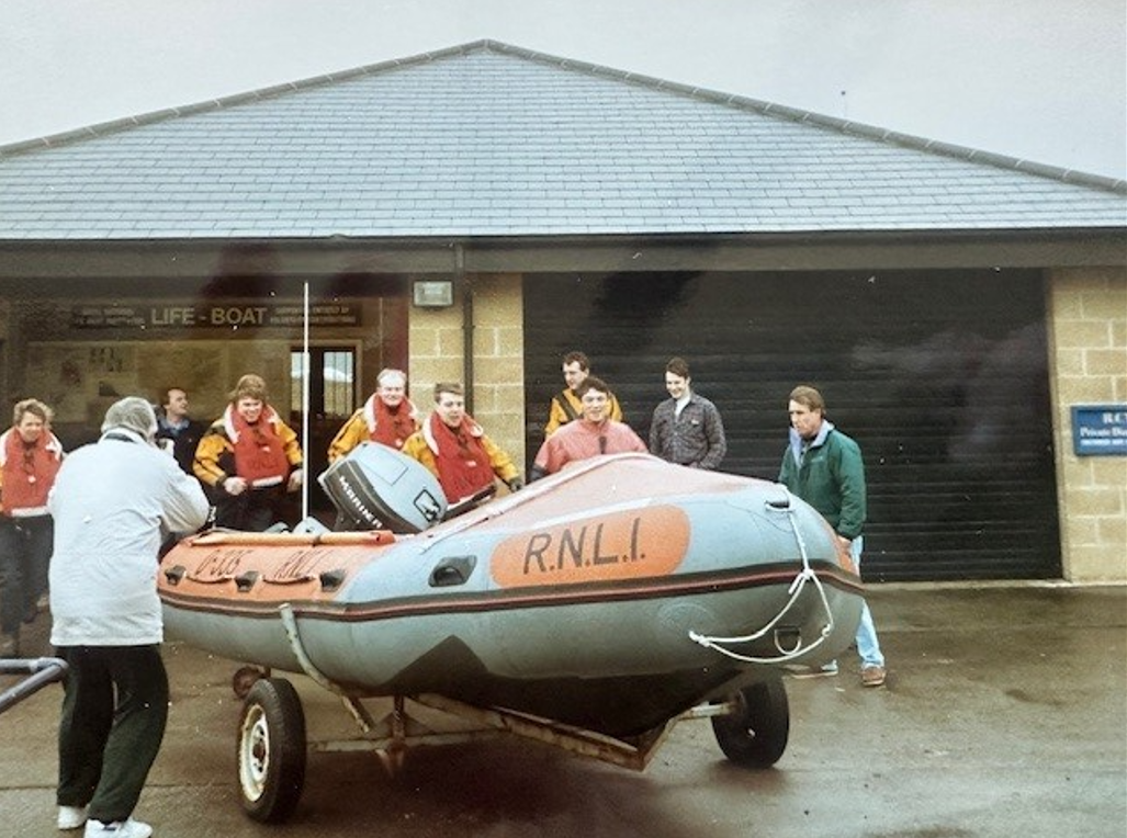 A D class lifeboat outside of the boat house