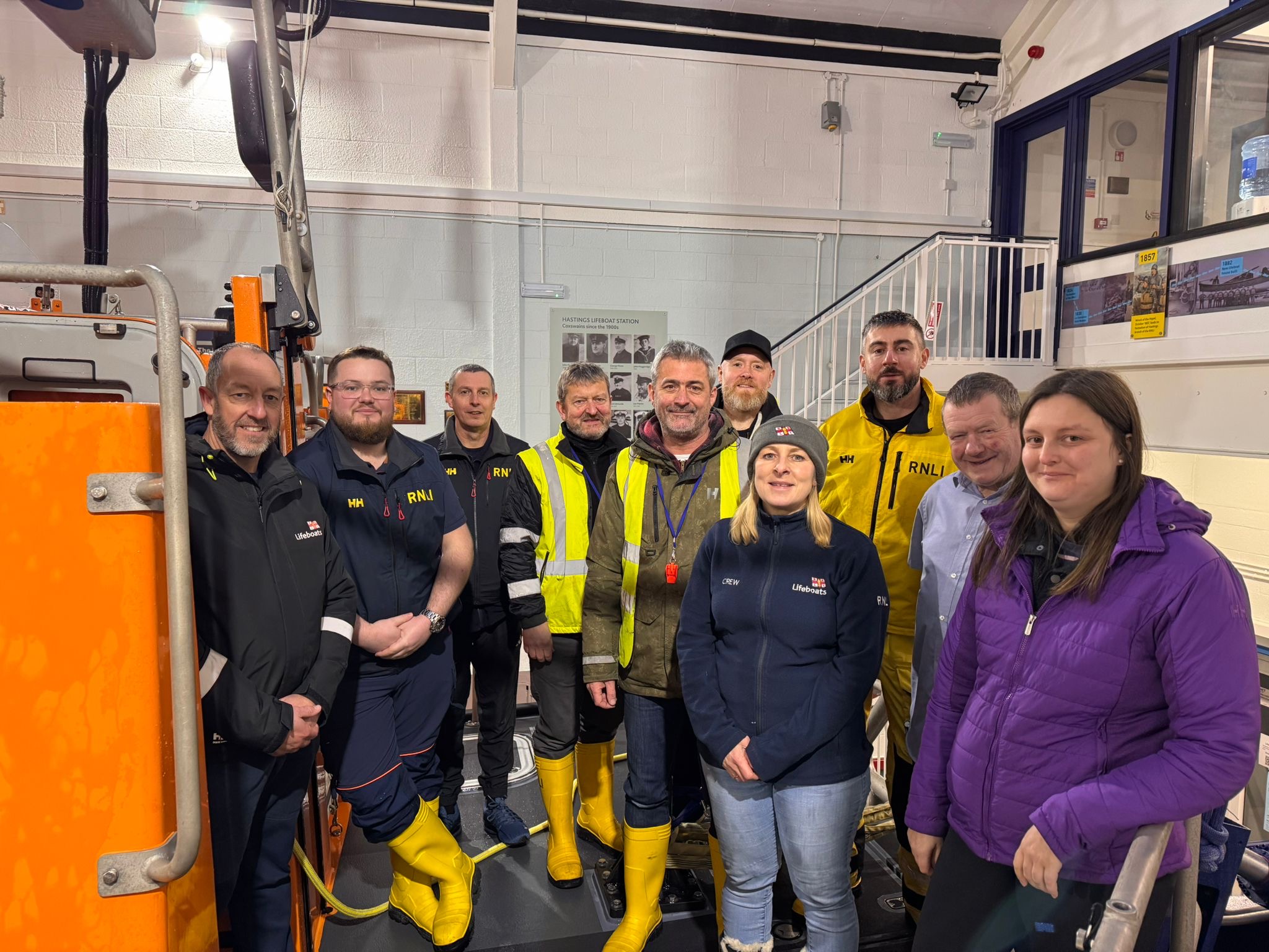 Group of volunteers on the lifeboat at Hastings RNLI lifeboat station