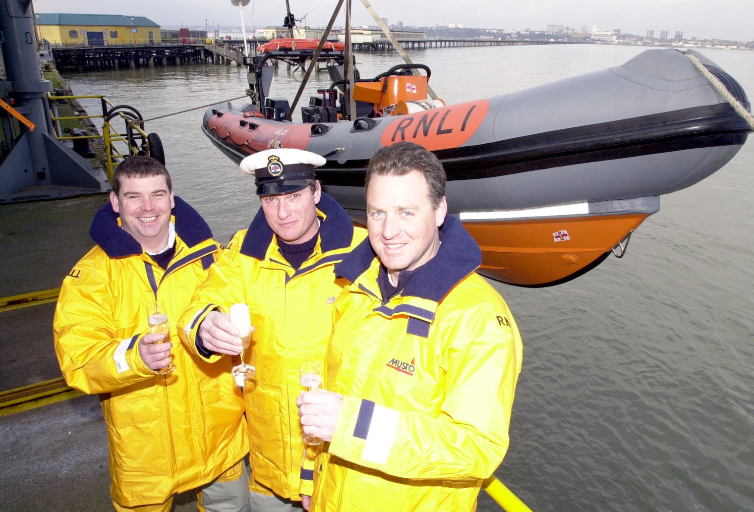Middle: Helm John Foster, bronze medal, left: Ian Rees, right Michael Whistler, Thanks On Vellum from the RNLI
