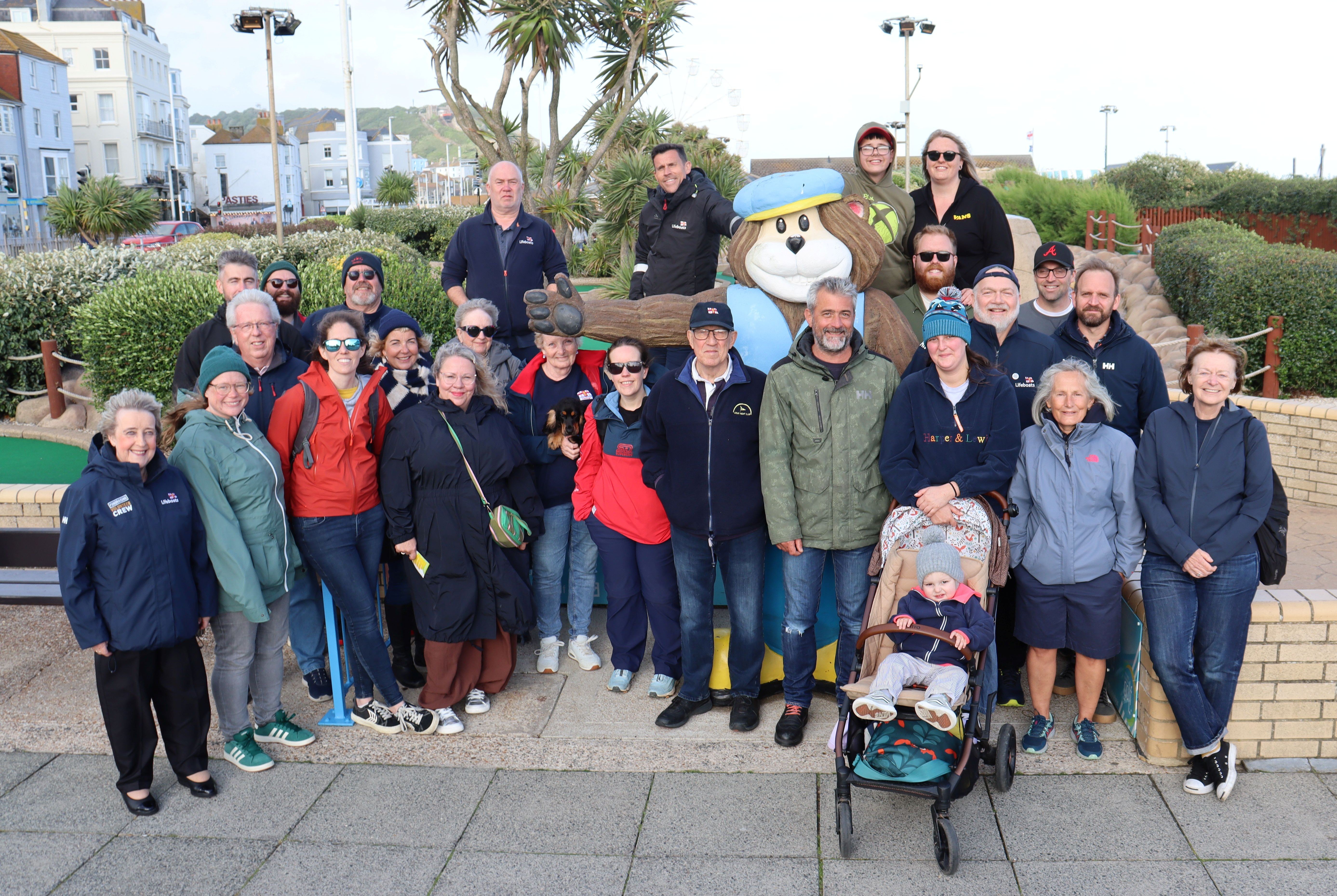 Group of volunteers standing on Hastings Crazy Golf course in June