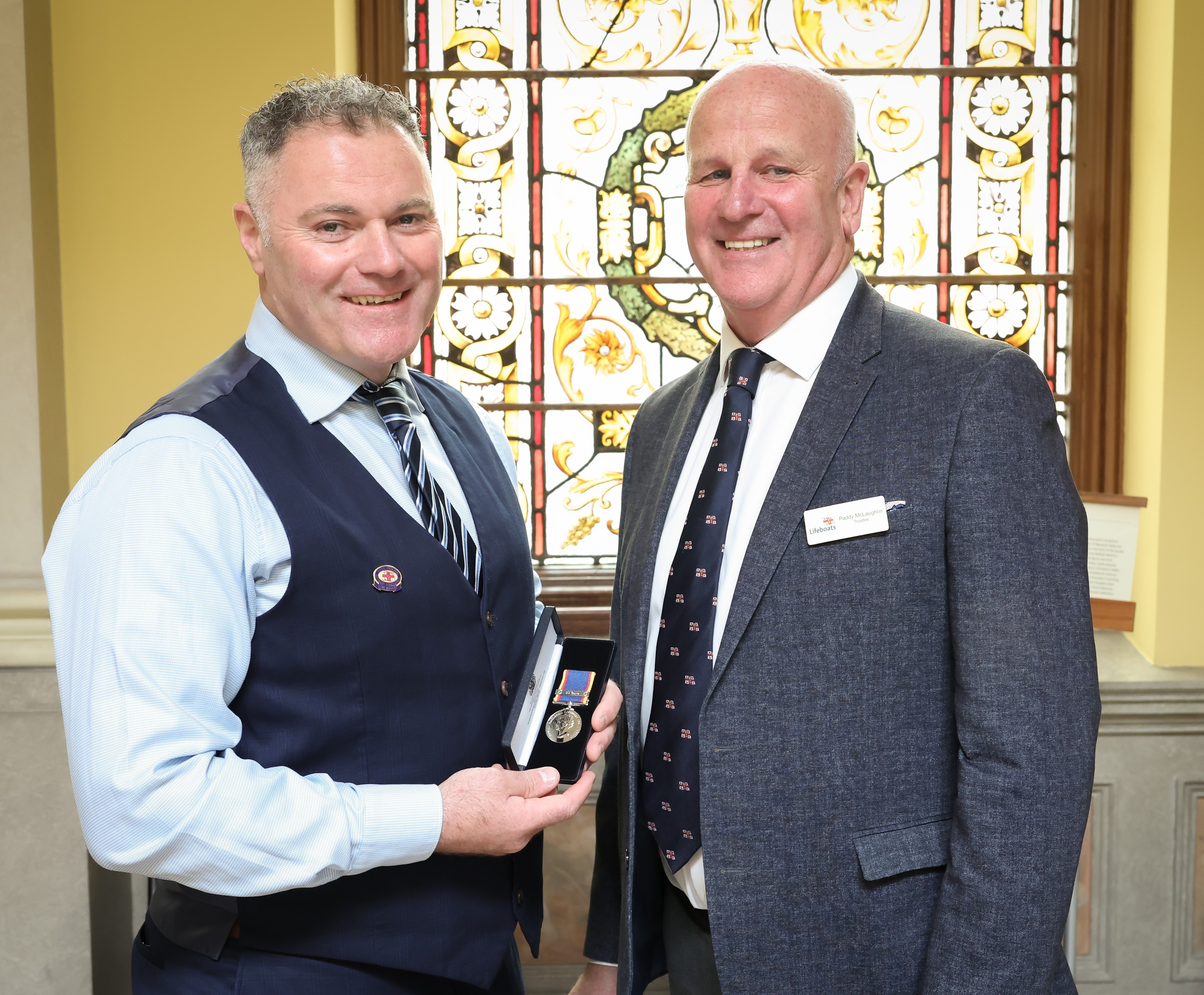Eamonn Mahon being presented with his 30 year service medal by Paddy McLaughlin, RNLI Truste