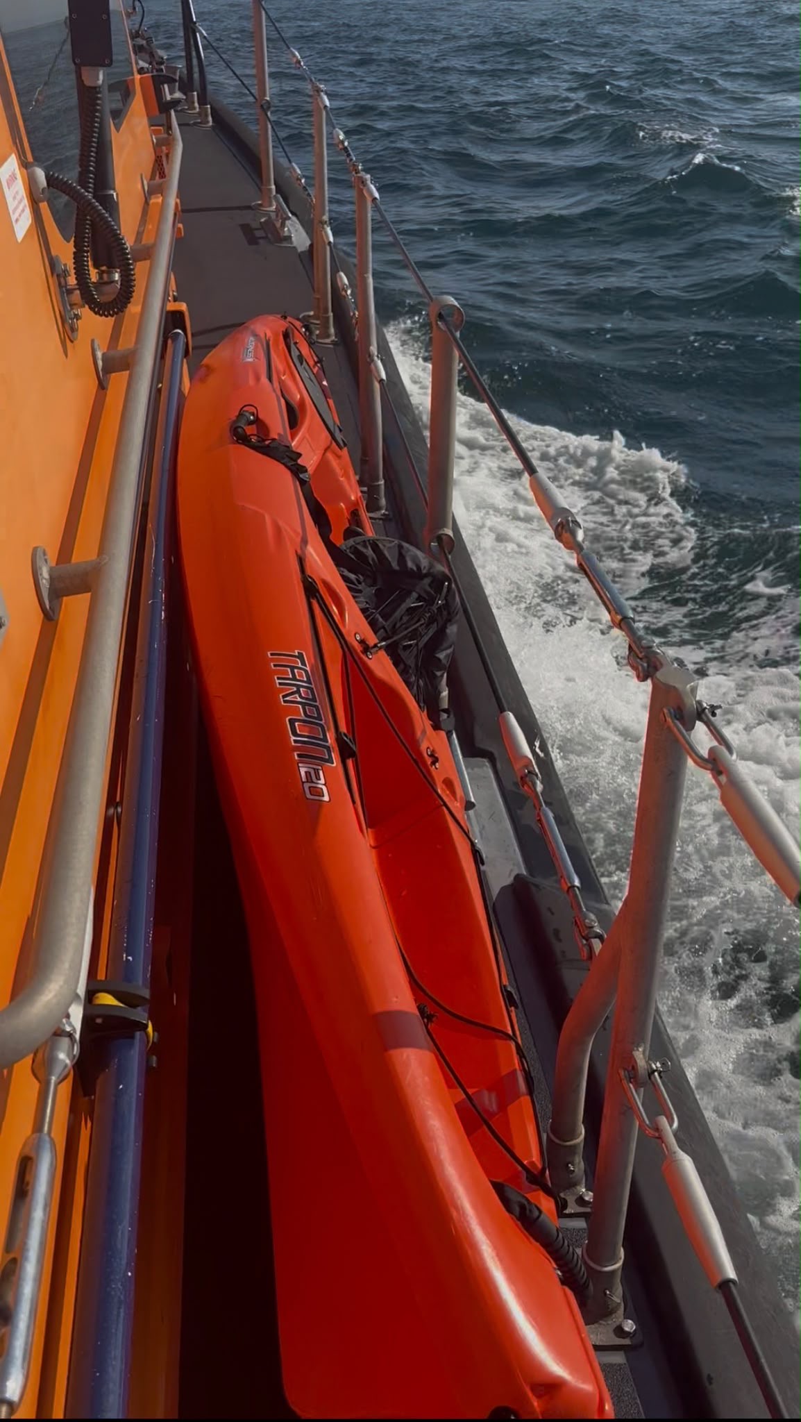 Portpatrick RNLI lifeboat with rescued kayak on board