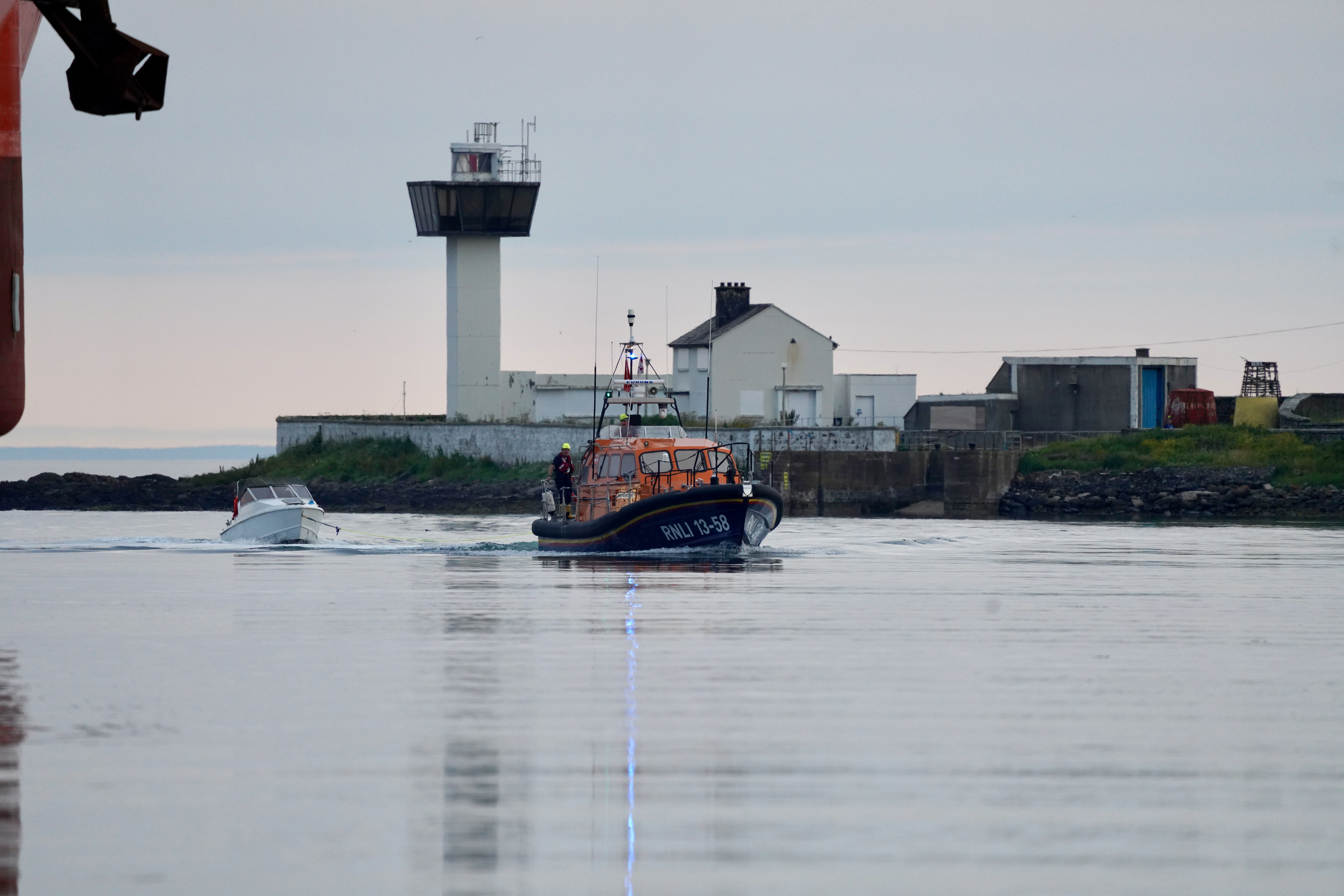 Larne RNLI Lifeboat Machiko Nancy entering the Port of Larne towing the casualties.
