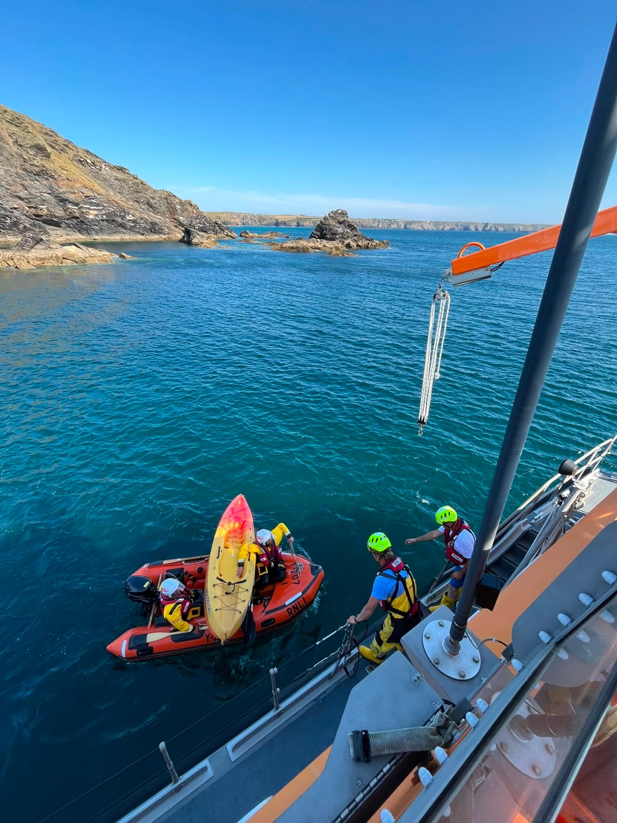 Pictures shows lifeboat recovering kayaks