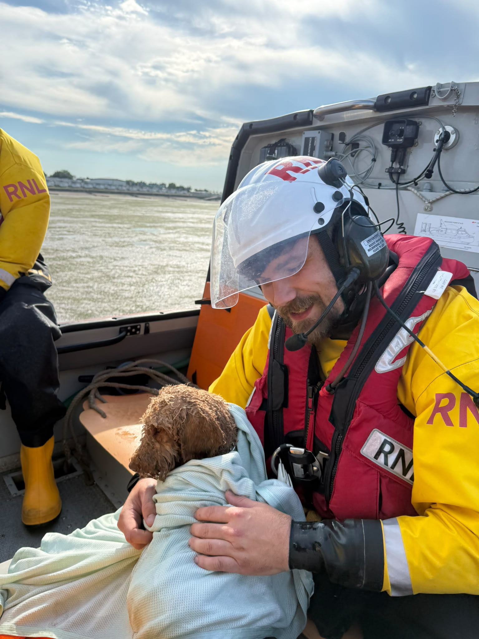 Benji with RNLI volunteer Tyler Bonham on the hovercraft