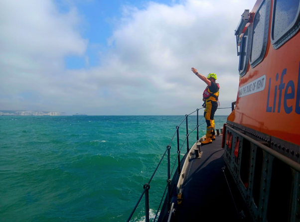 The lifeboat crew locating the casualty off Sandgate