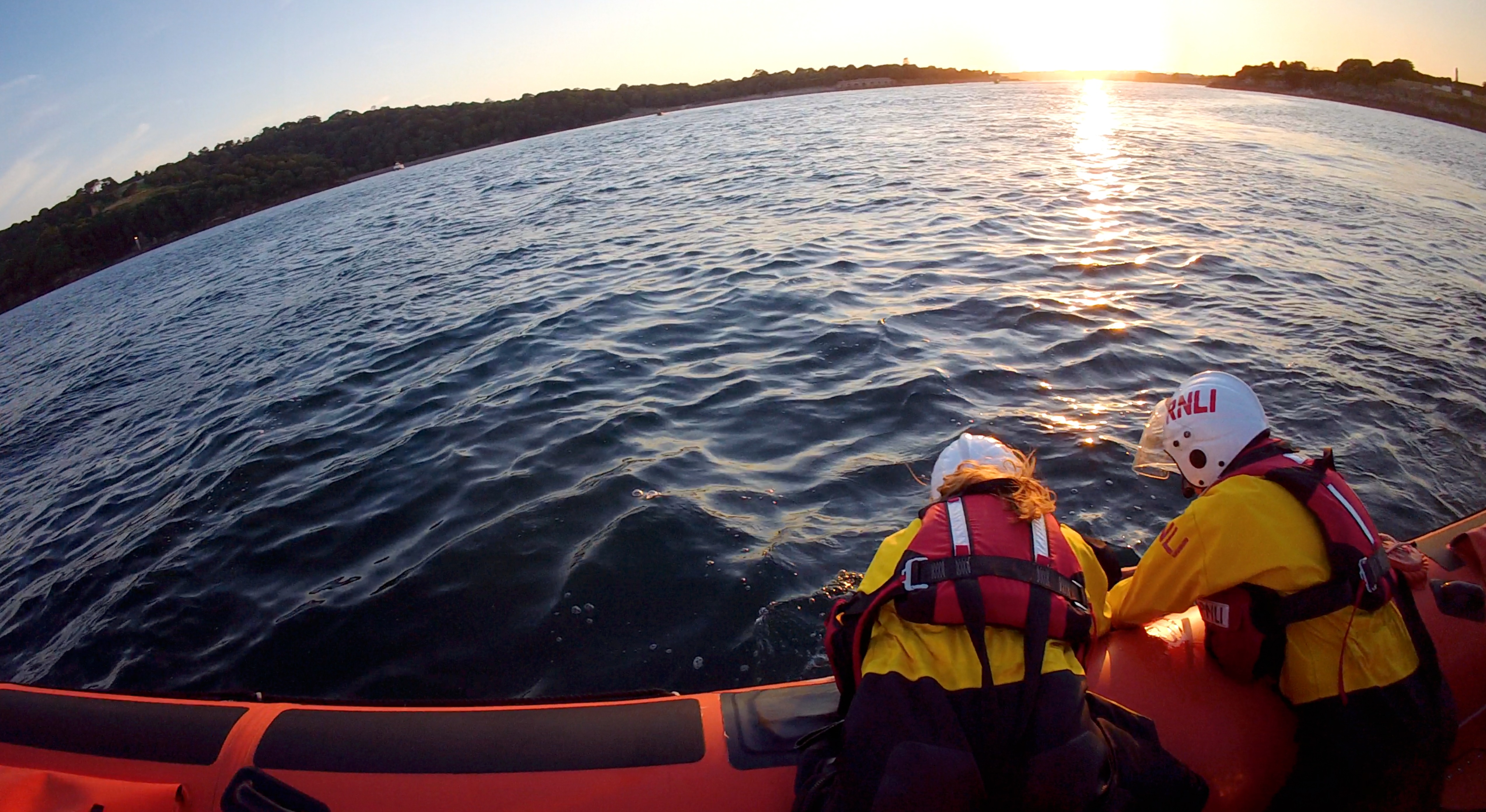 Plymouth RNLI volunteers recovering casualty from the water