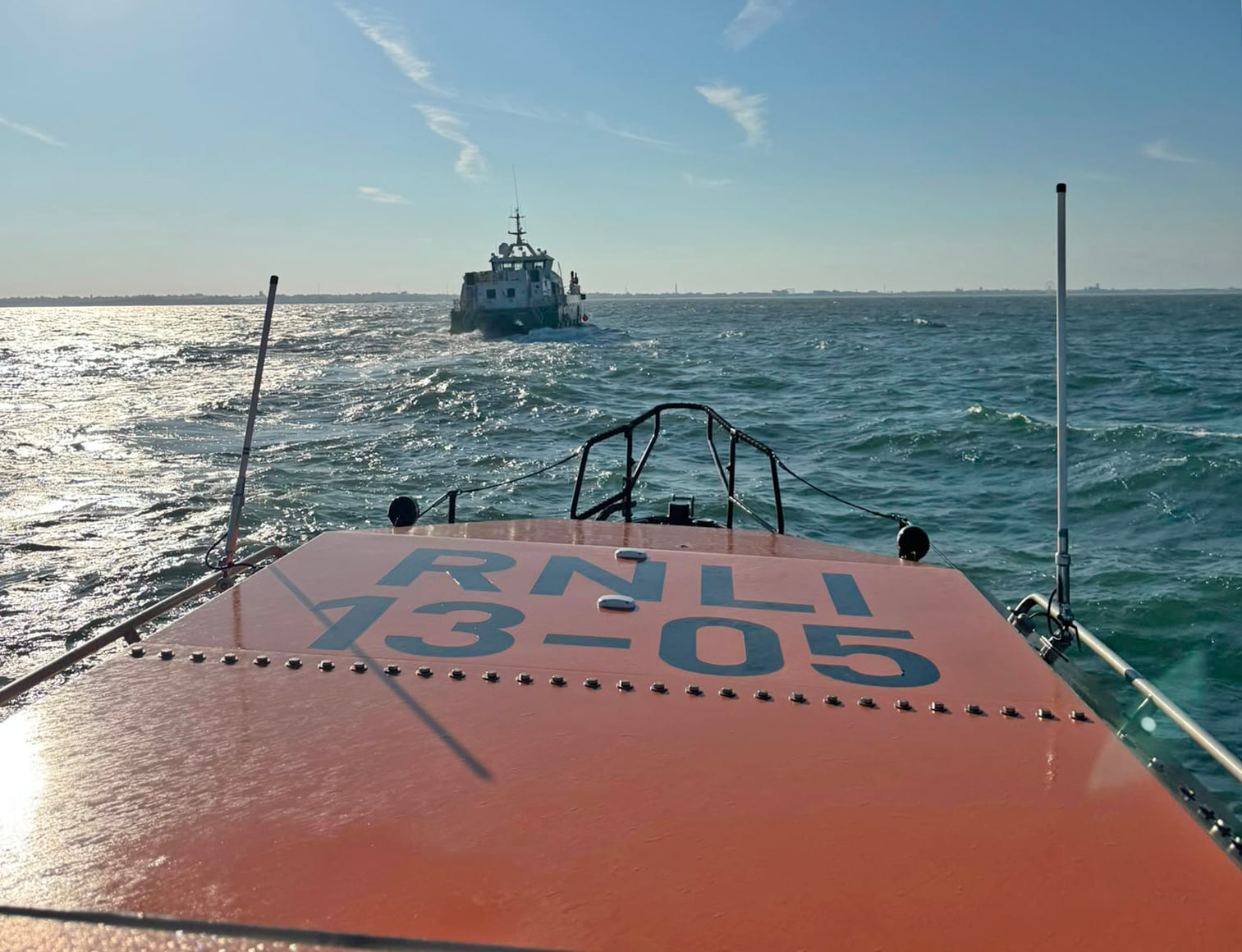 Lowestoft RNLI Lifeboat with the Crew Transfer Vessel which was taking on water