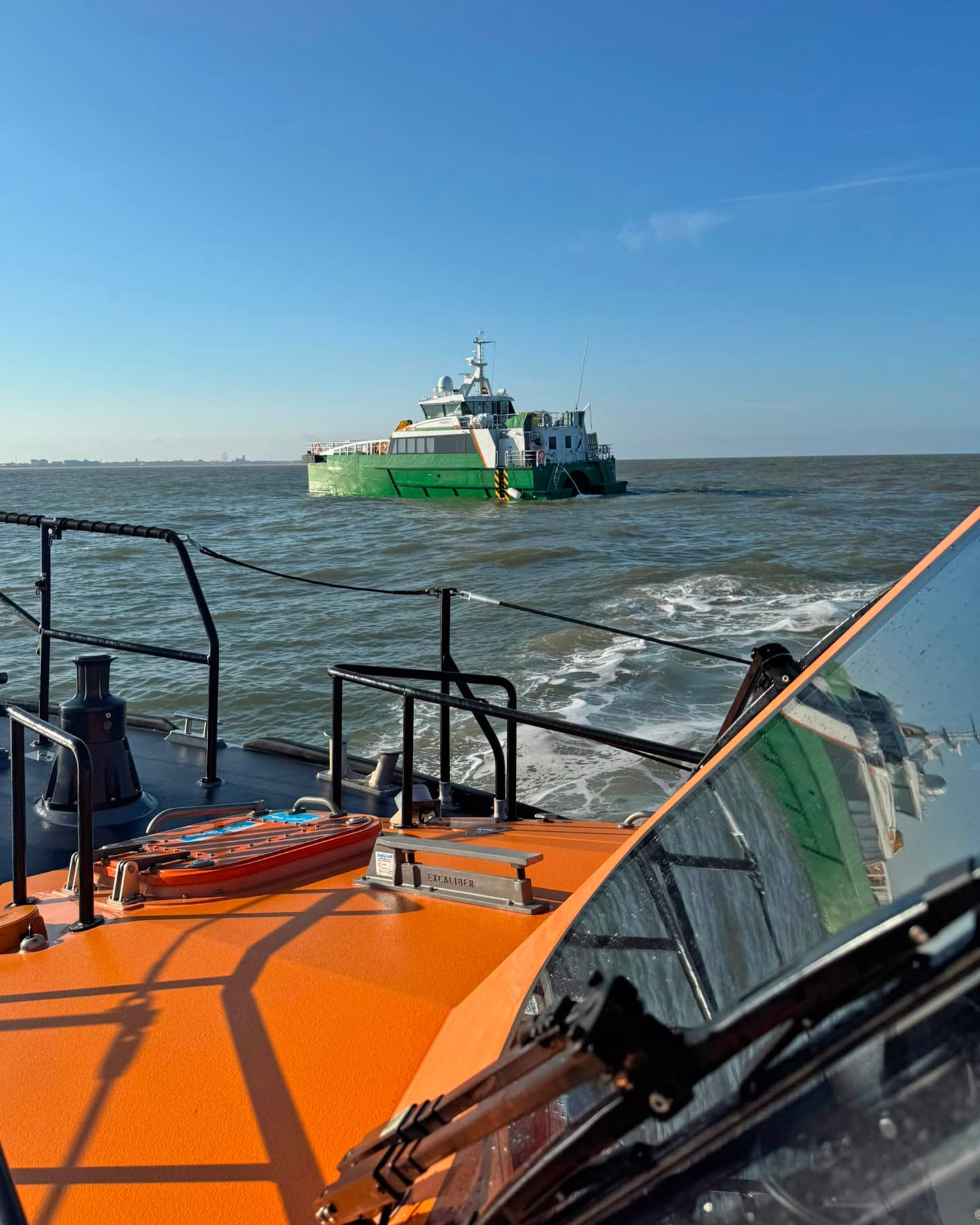 Lowestoft RNLI Lifeboat with the Crew Transfer Vessel which was taking on water