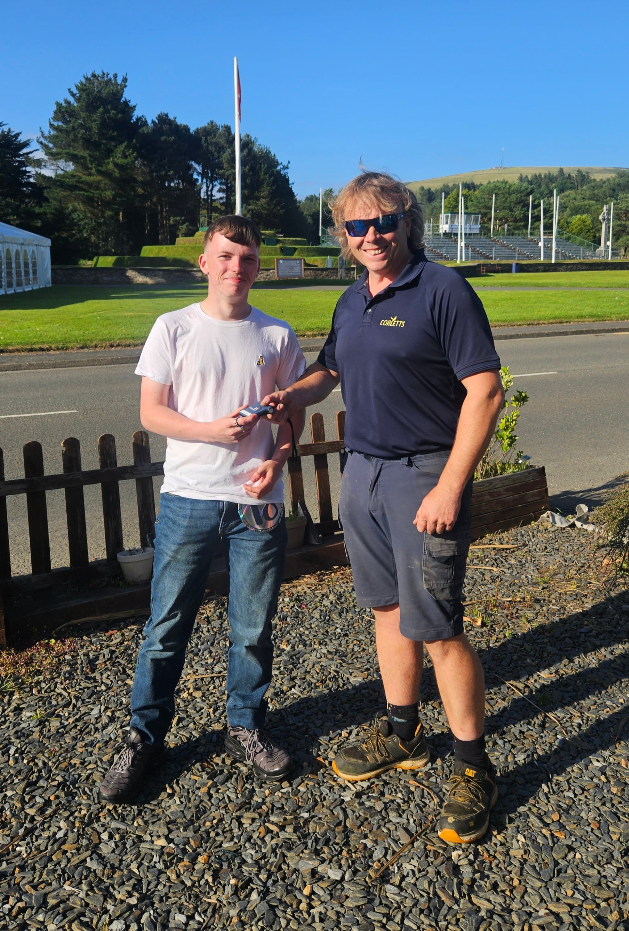 Jon Corlett, one of four Coxswains at Peel RNLI, presenting Jordan with his long-awaited pager.