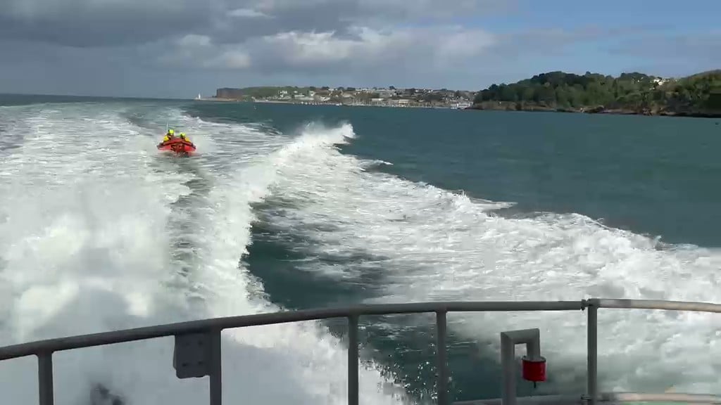Torbay RNLI's D class Inshore lifeboat following the Severn class All-Weather lifeboat across Tor Bay