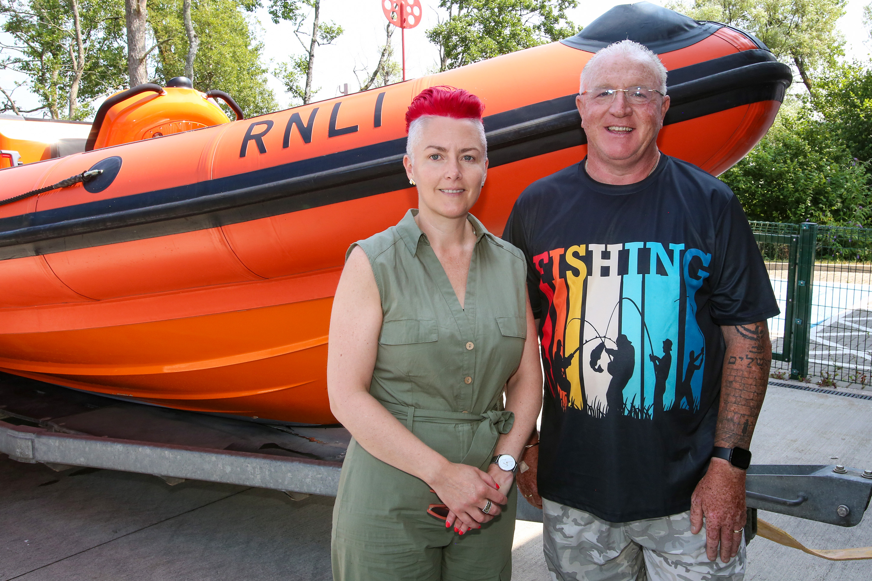 Lynda and John pictured with Lough Ree lifeboat in the background