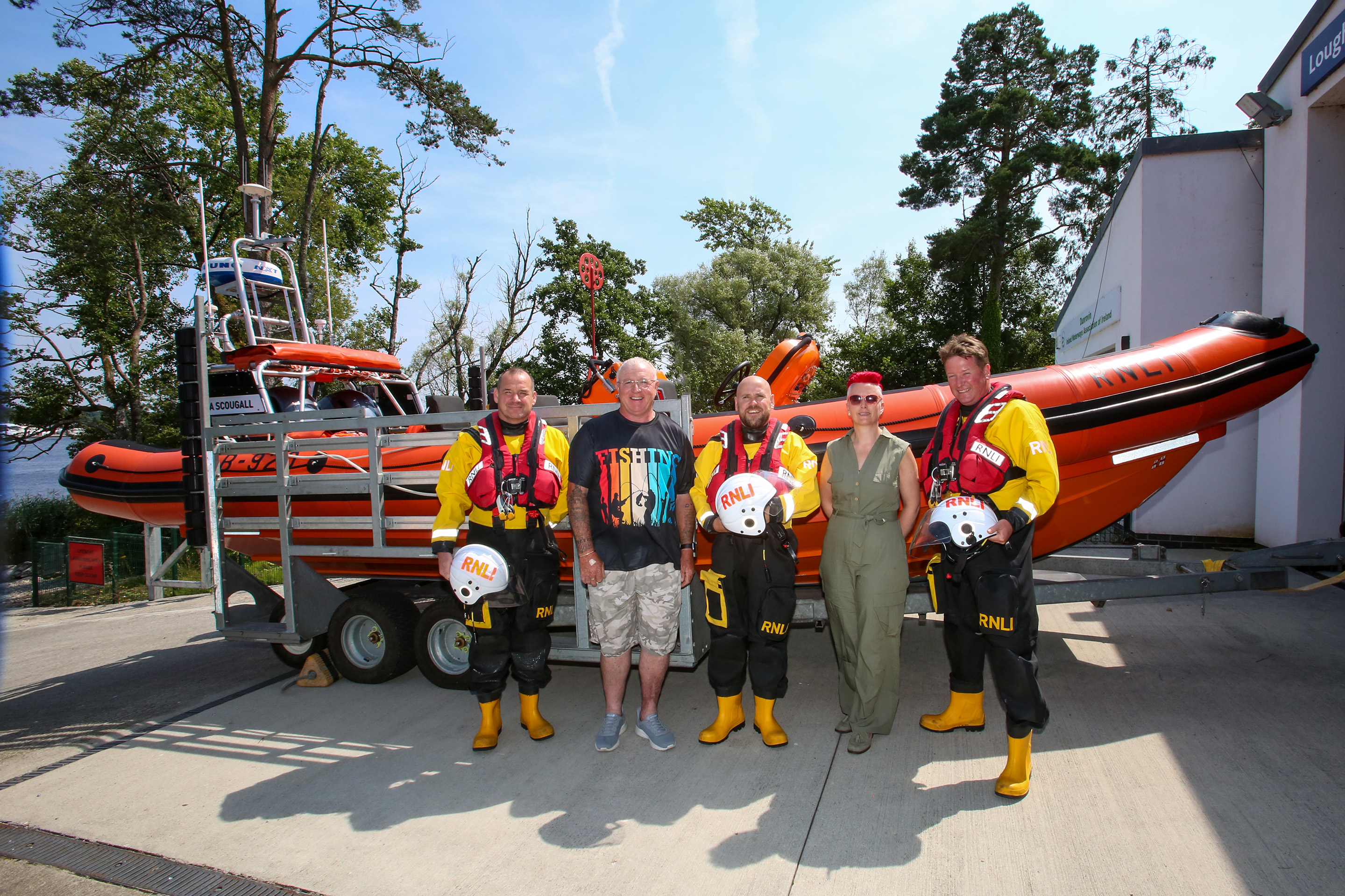 John and Lynda pictured with the lifeboat crew at Lough Ree and lifeboat in background