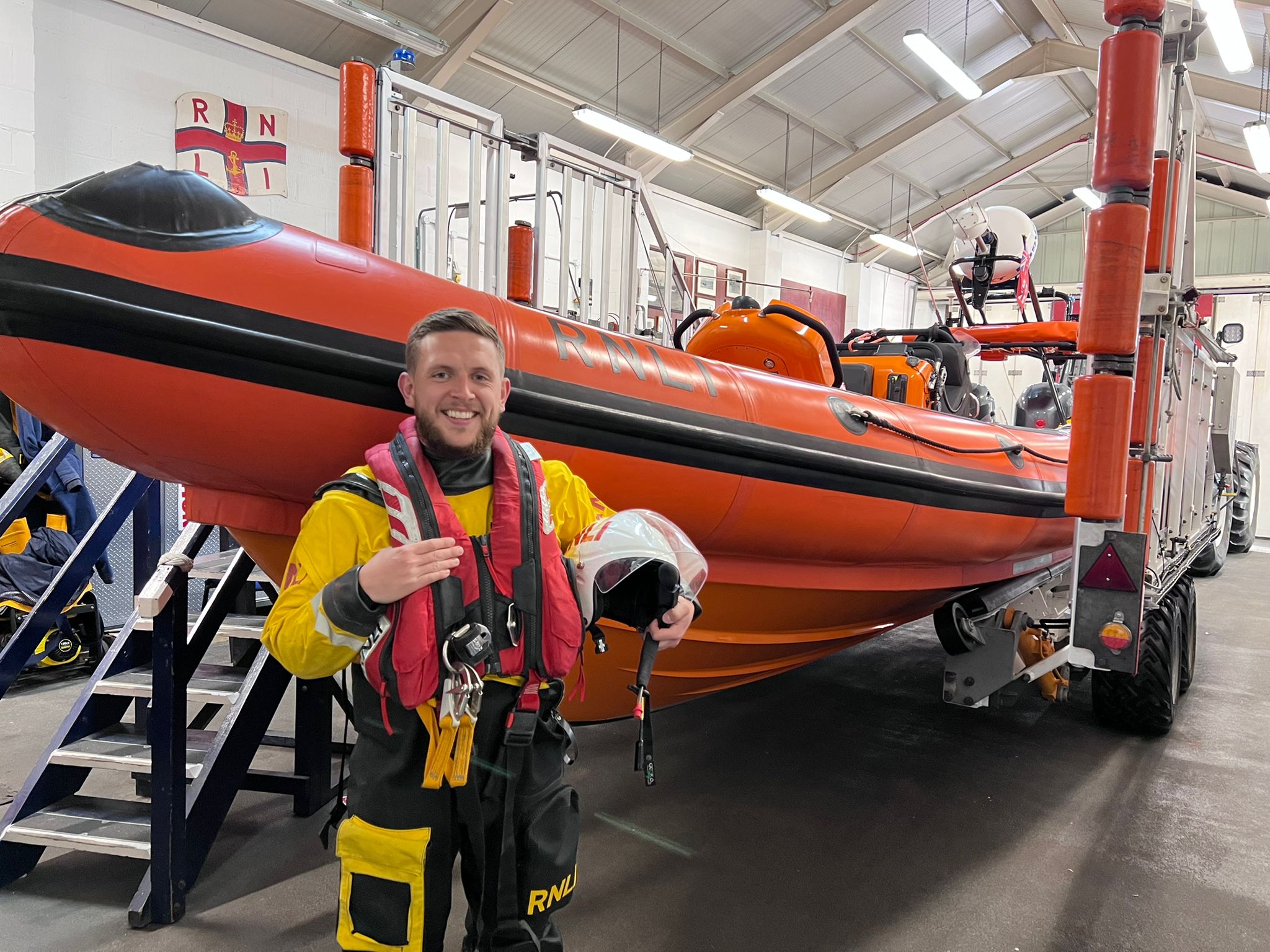 New Brighton's newest helm standing infront of the Atlantic 85 Lifeboat 