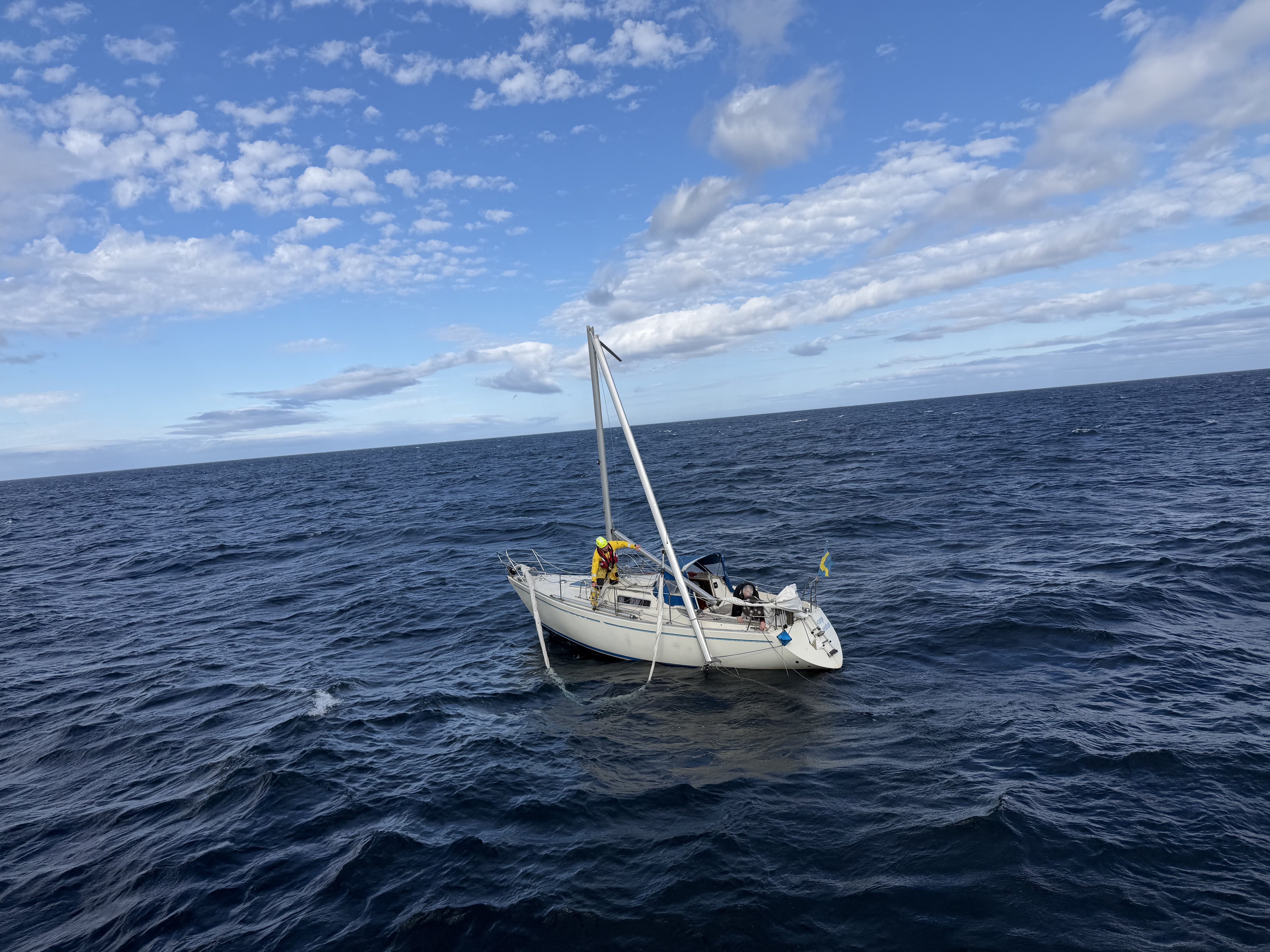 Wick RNLI volunteer on board casualty yacht