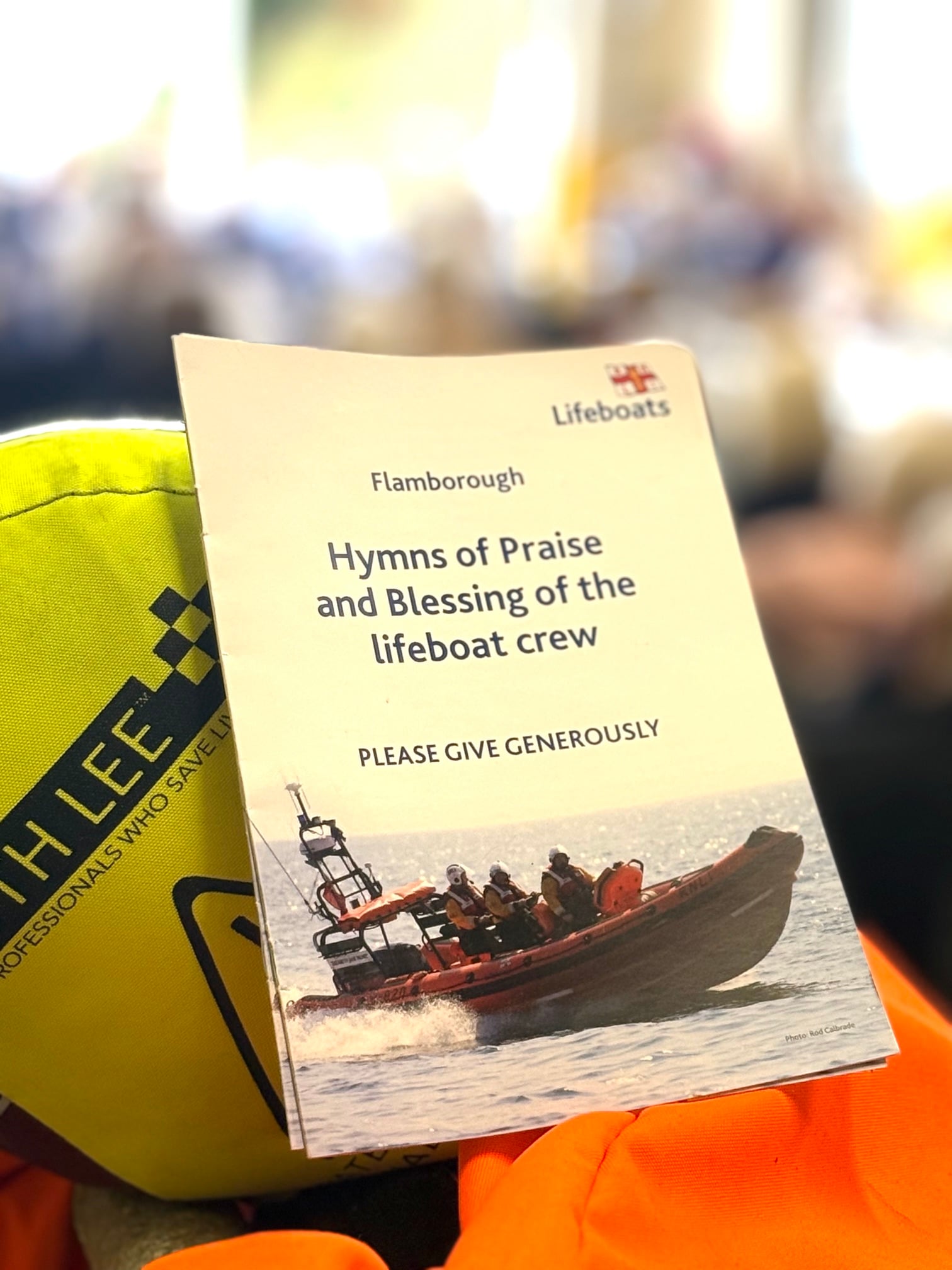 photo of the order of service with a atlantic 85 lifeboat on the cover
