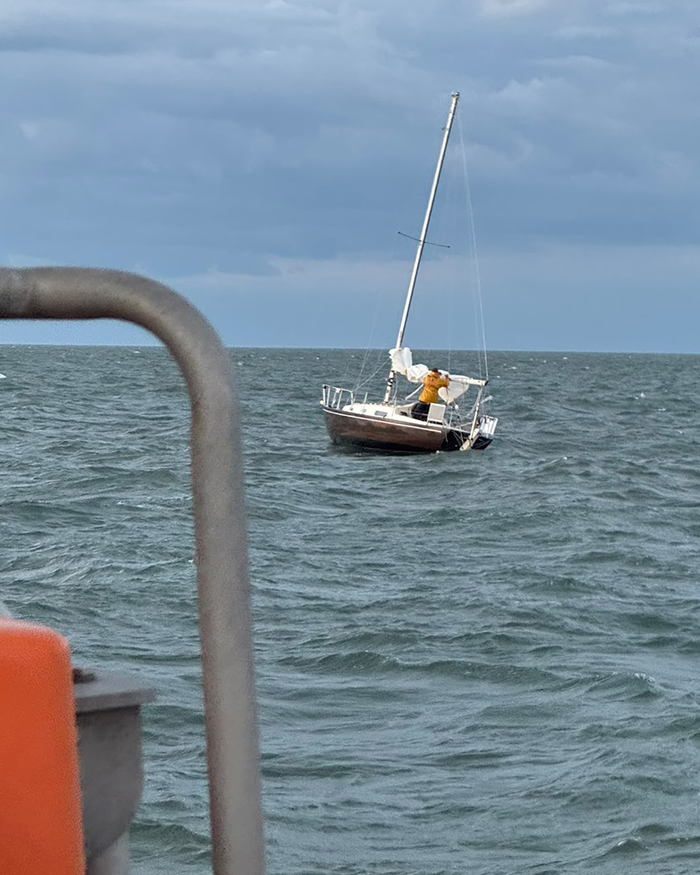 Lowestoft RNLi lifeboat with the yacht getting ready to be towed