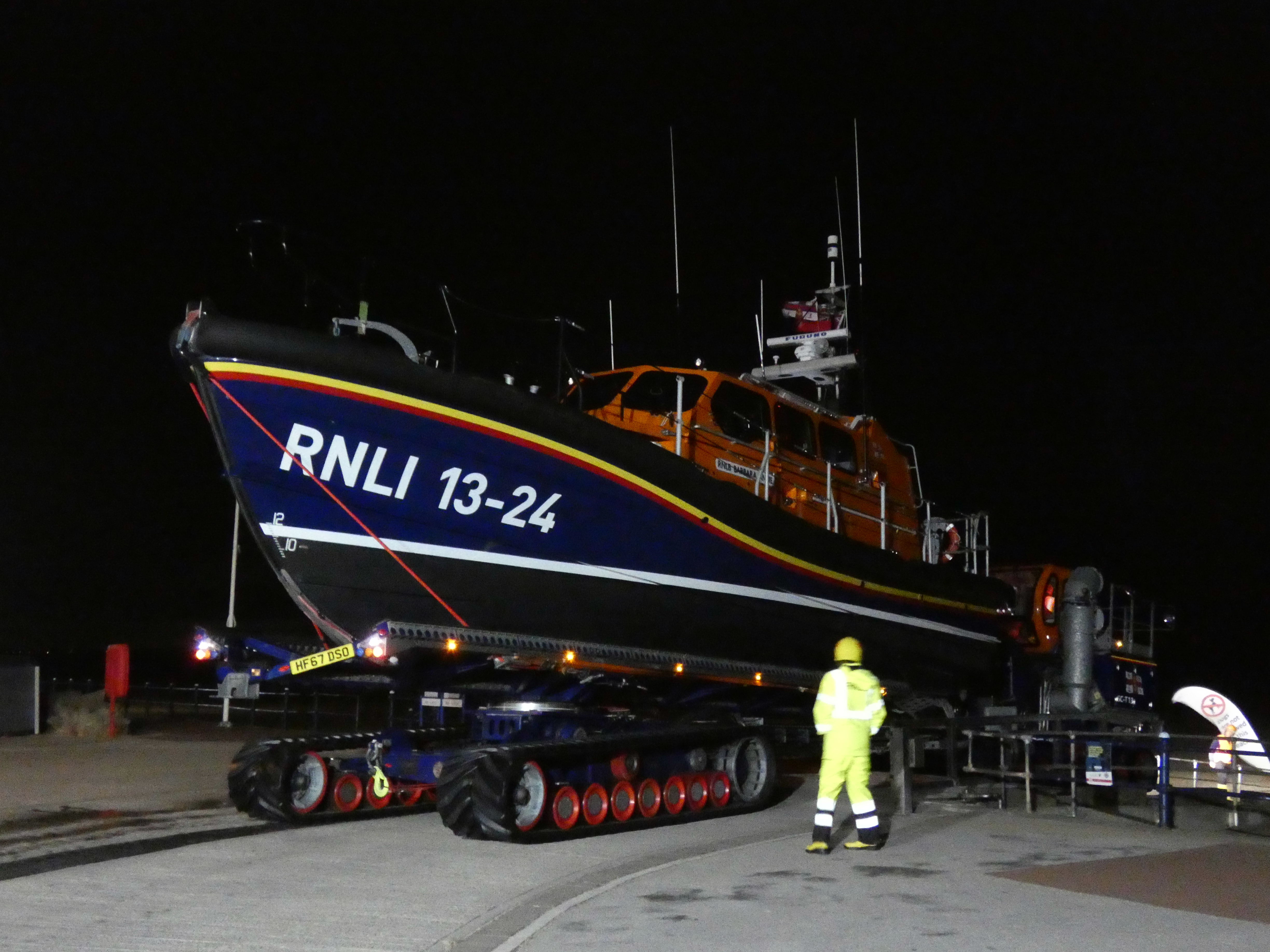 A Lifeboat disappears into the darkness as she leaves