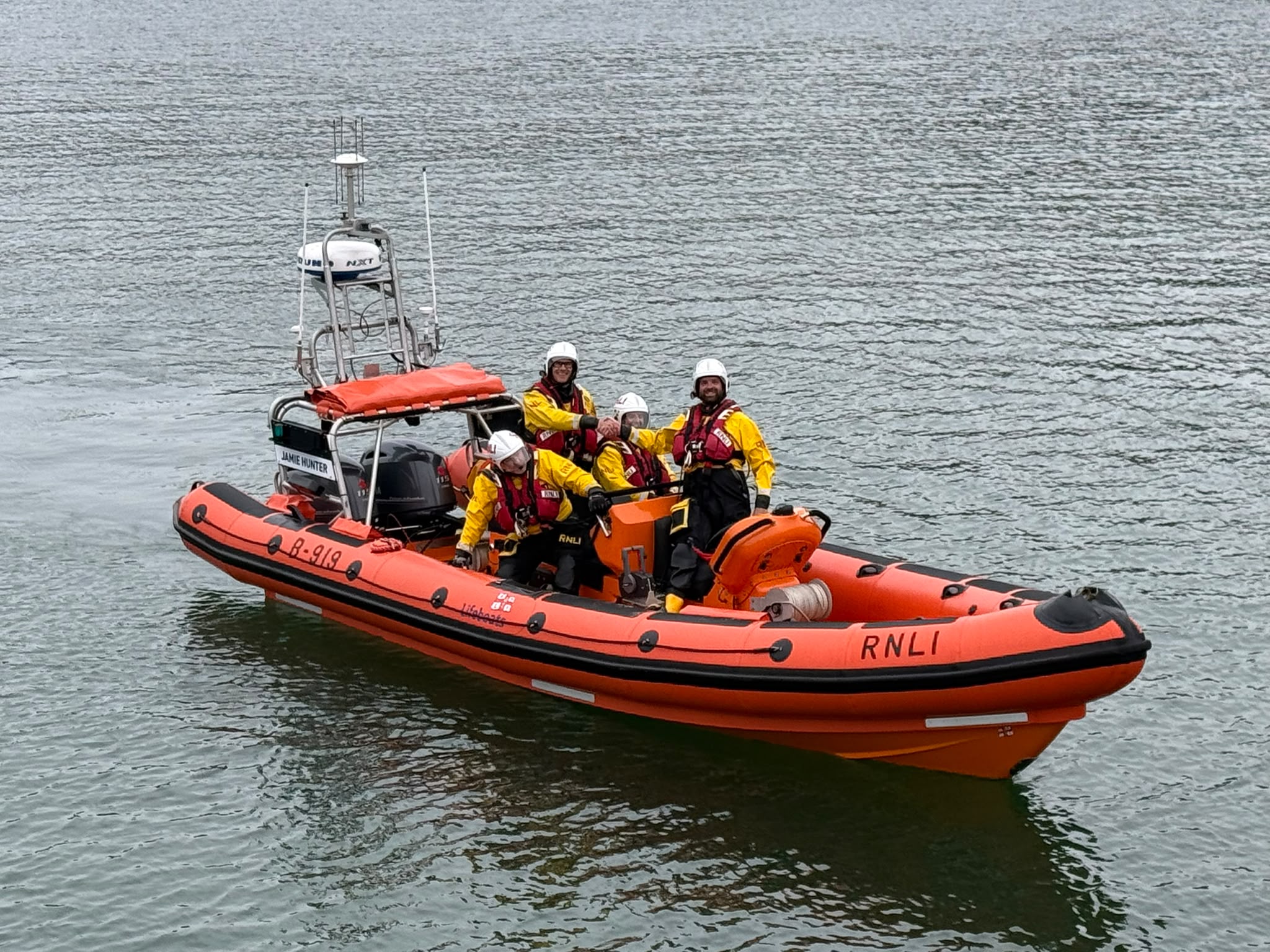 RNLI Atlantic 85 on the water with four volunteer crew on board