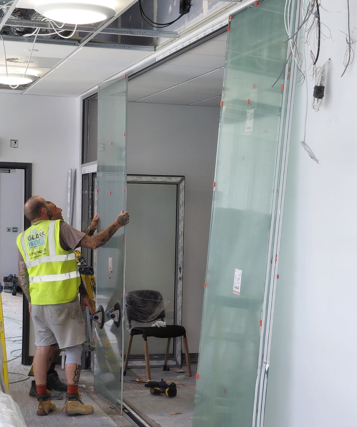 Glazed screens being fitted for the training/meeting room
