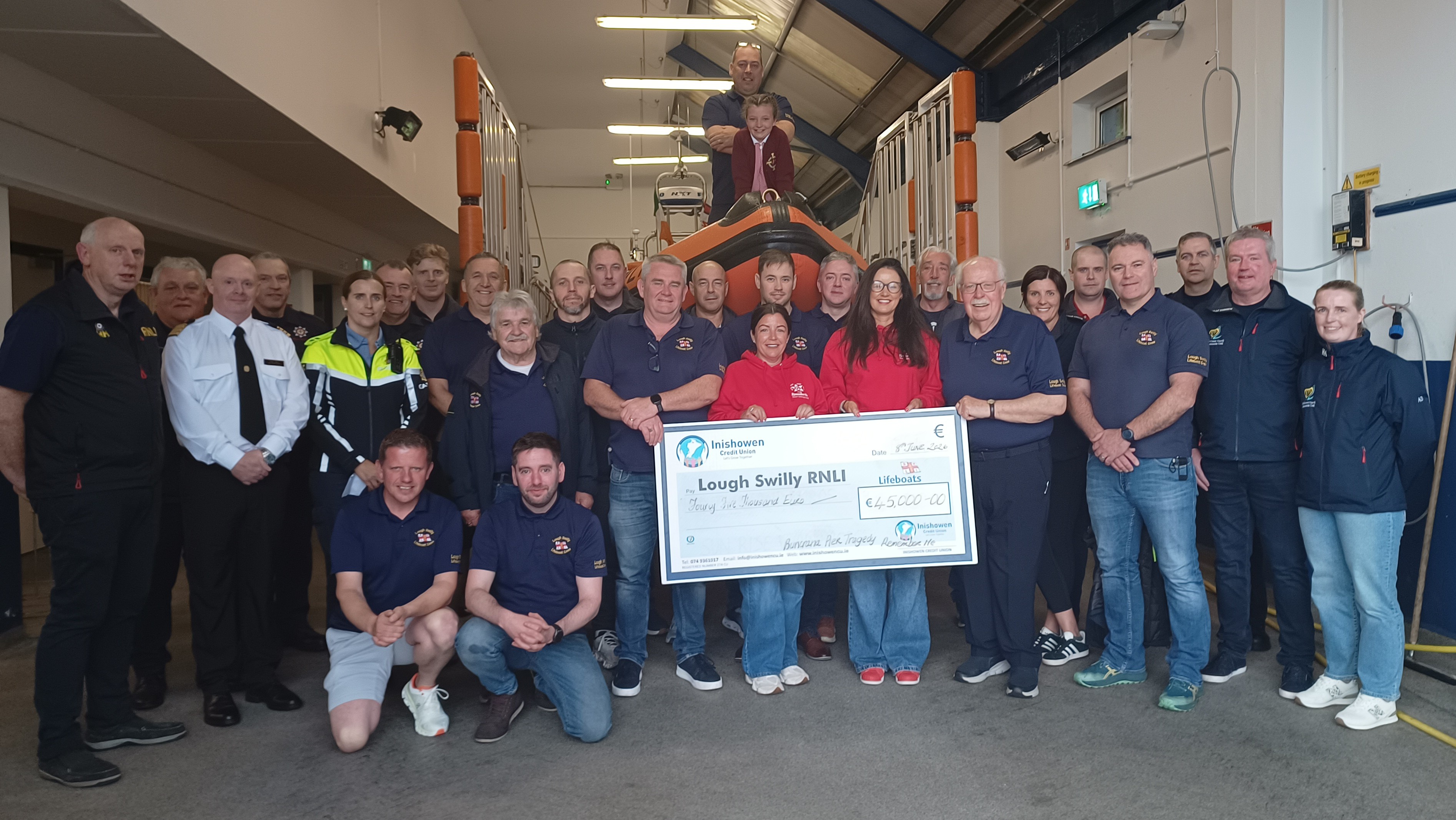 Louise James presenting funds raised from the Remember Me Campaign to representatives from Lough Swilly RNLI, Greencastle Coast Guard, Malin Head Marine Rescue Sub-Centre, Buncrana Garda Síochána and Buncrana Fire Services