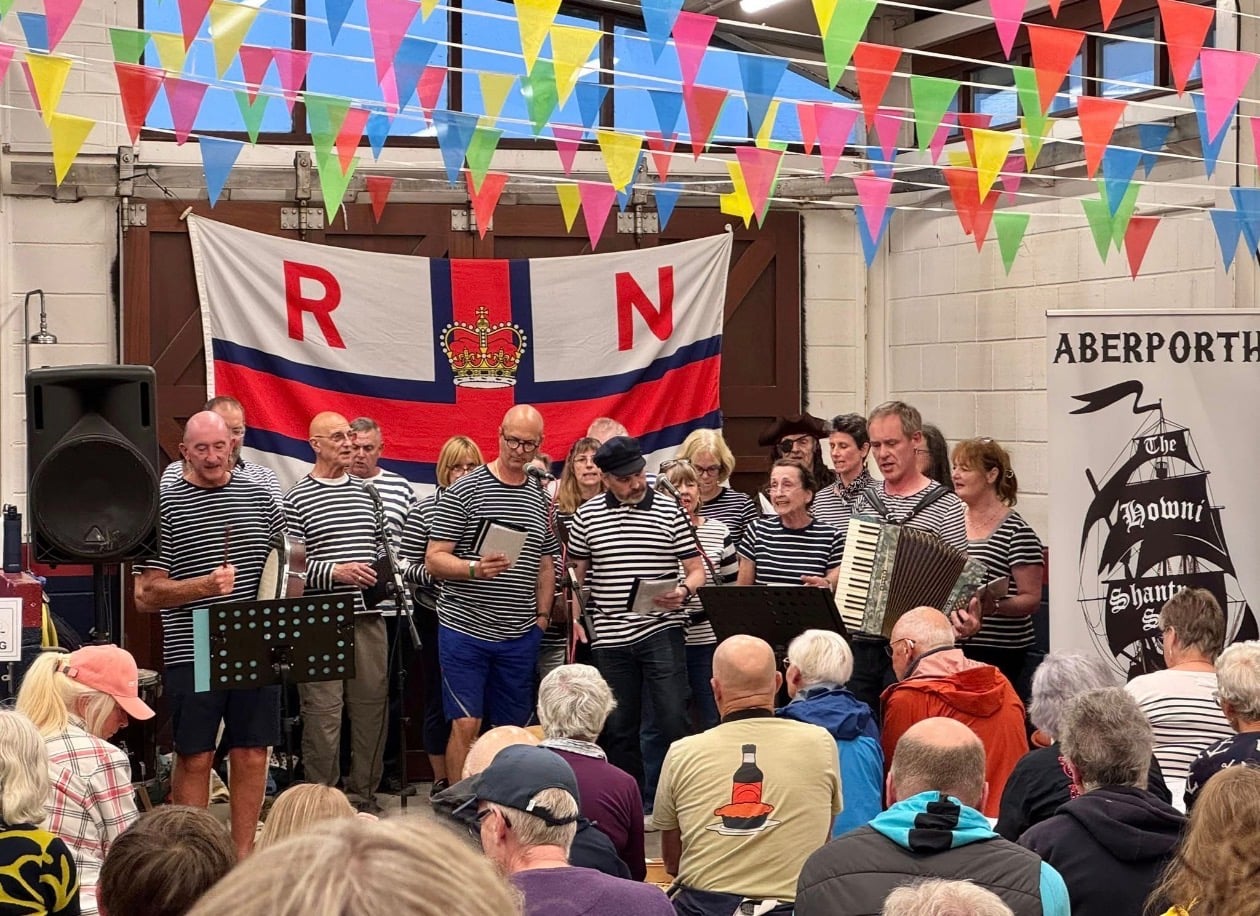 The Howni Shanty Singers entertain a crowd at Cardigan’s Lifeboat Station