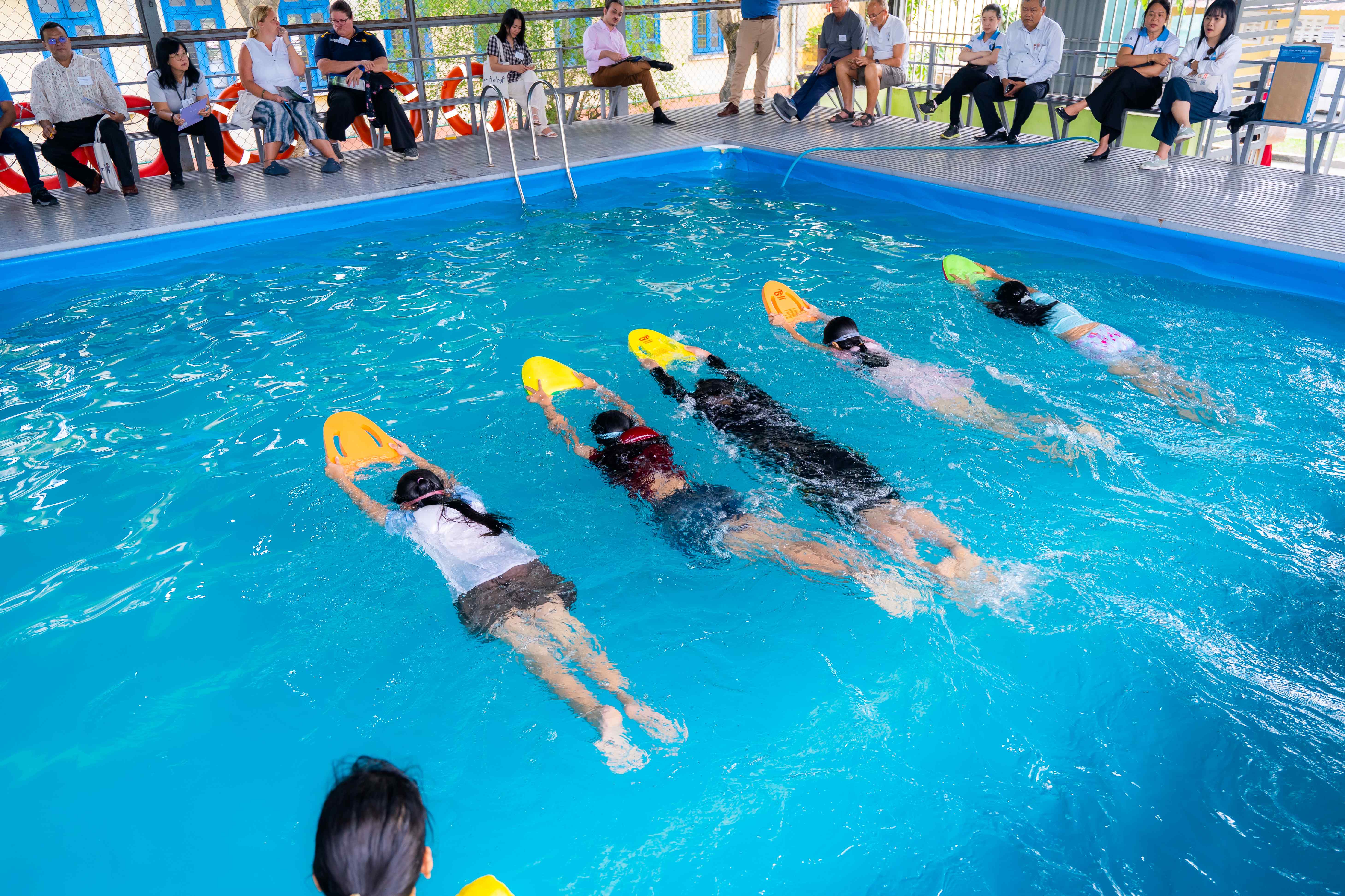 Children practicing swimming skills at the workshop 