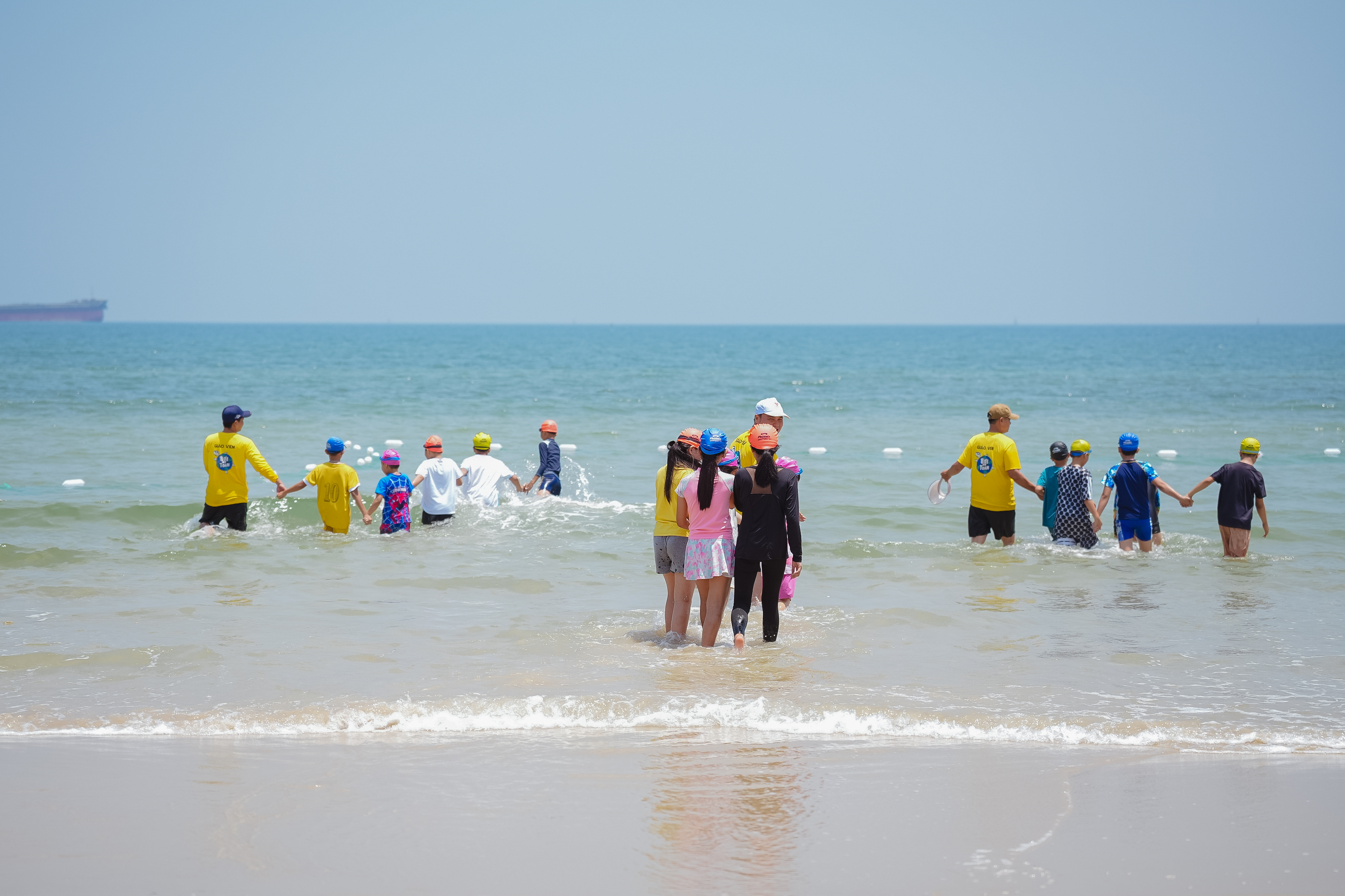 Children practicing swimming skills at the workshop 