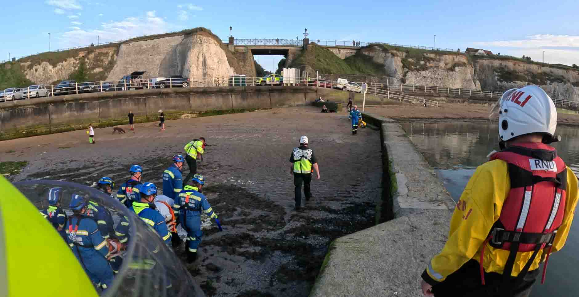 The casualty is transferred from the tidal pool wall to the sands (RNLI Margate)