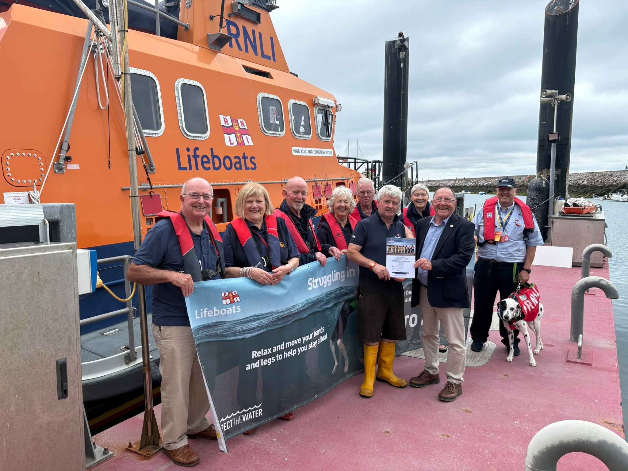 Rotary Club President, Roy Tuttle, presents £1,000 cheque to Torbay Coxswain, Richard Fowle