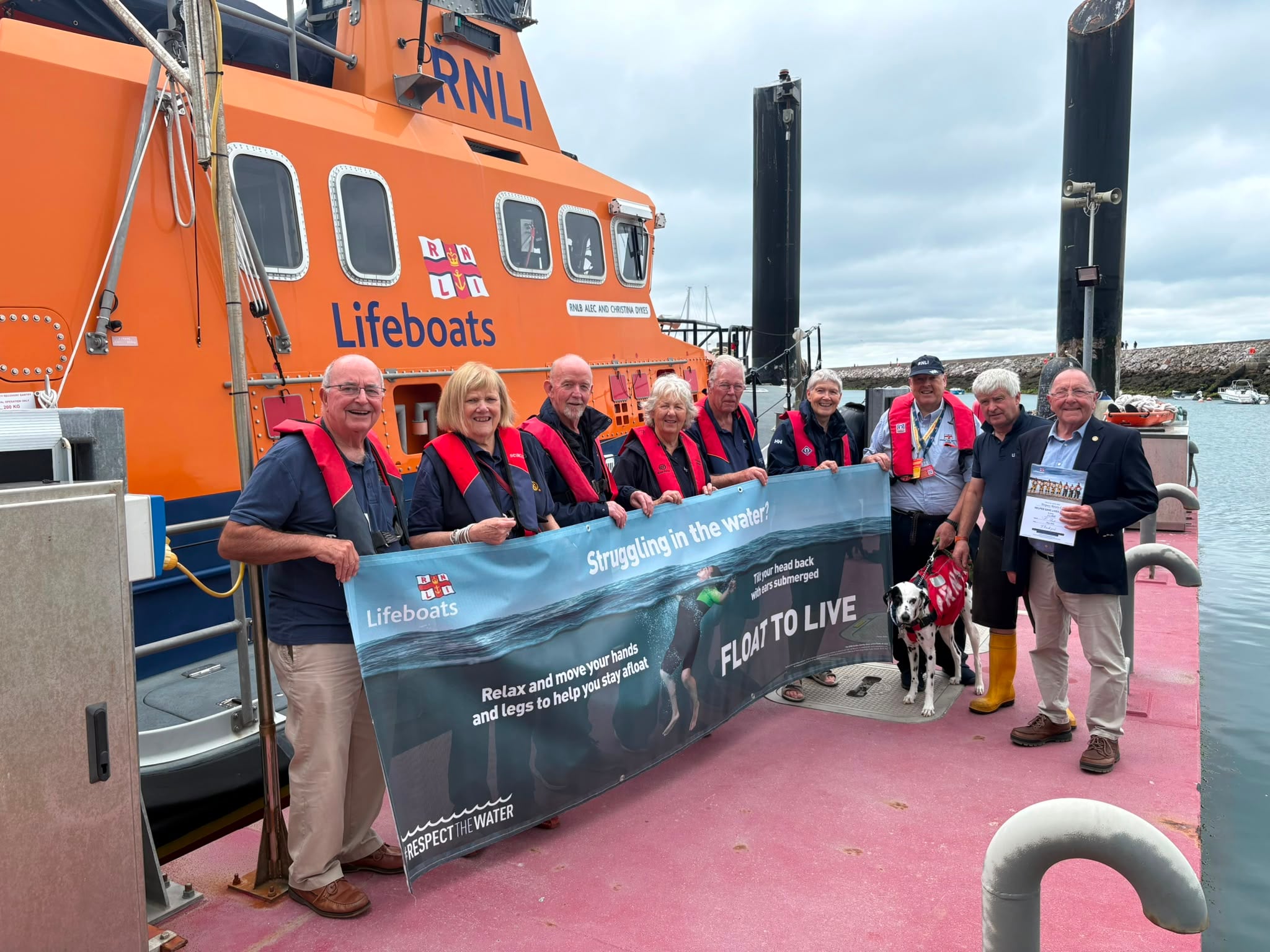 Rotary Club President, Roy Tuttle, presents £1,000 cheque to Torbay Coxswain, Richard Fowle
