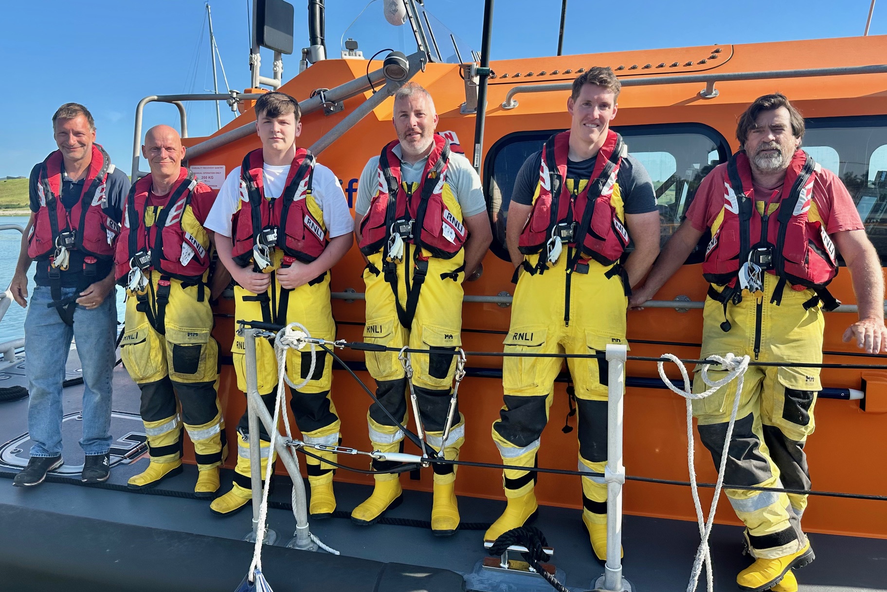 The first call out crew on the lifeboat after the shout, including Coxswain Ken Cashman