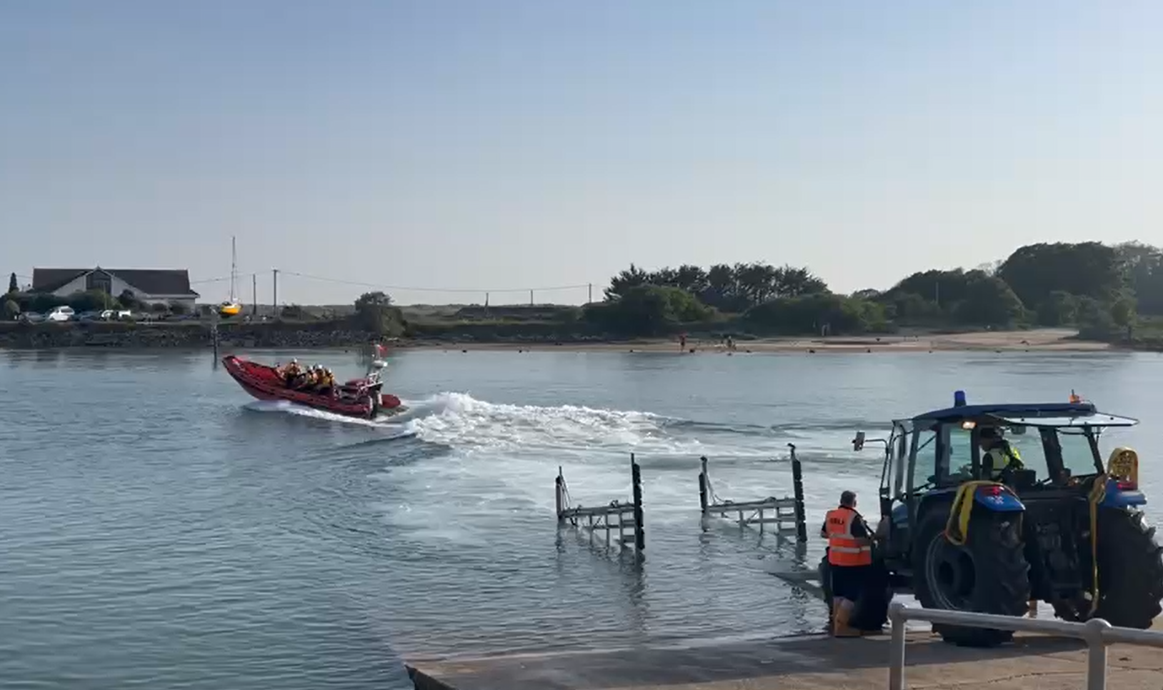 The crew of Littlehampton RNLI B Class lifeboat Renee Sherman launch into the River Arun to rescue swimmers struggling in the incoming tide.