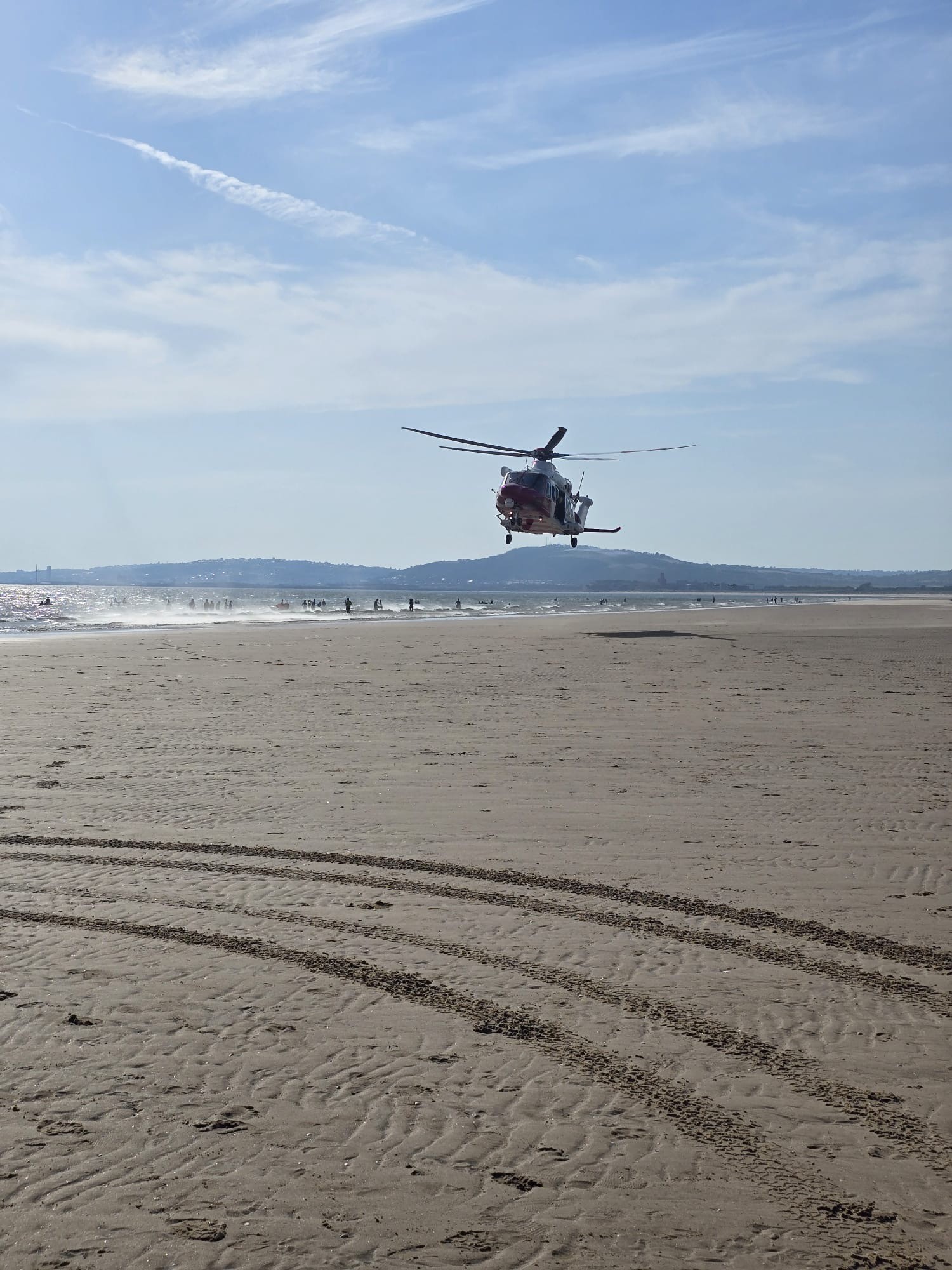 portrait image of helicopter landing on Aberavon beach 