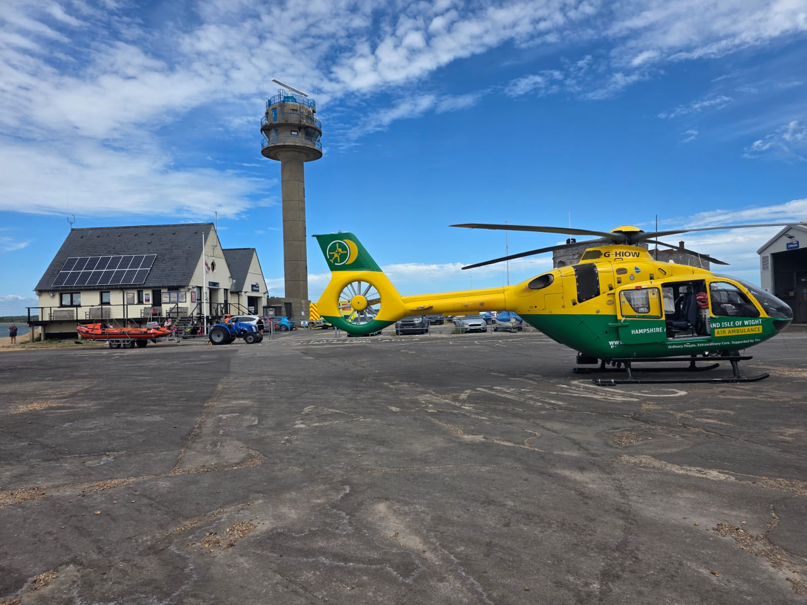 Air Ambulance with Calshot RNLI station in background