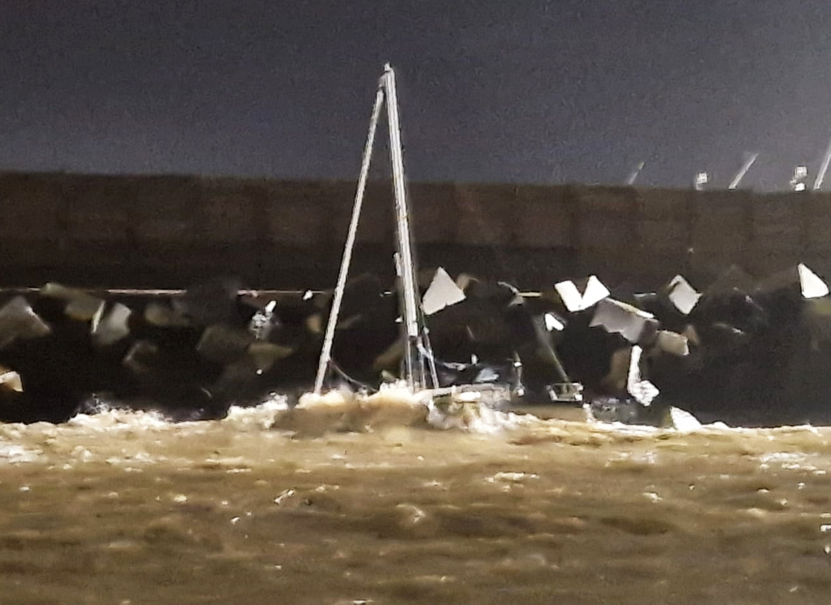 Yacht stranded on rocks off Lowestoft
