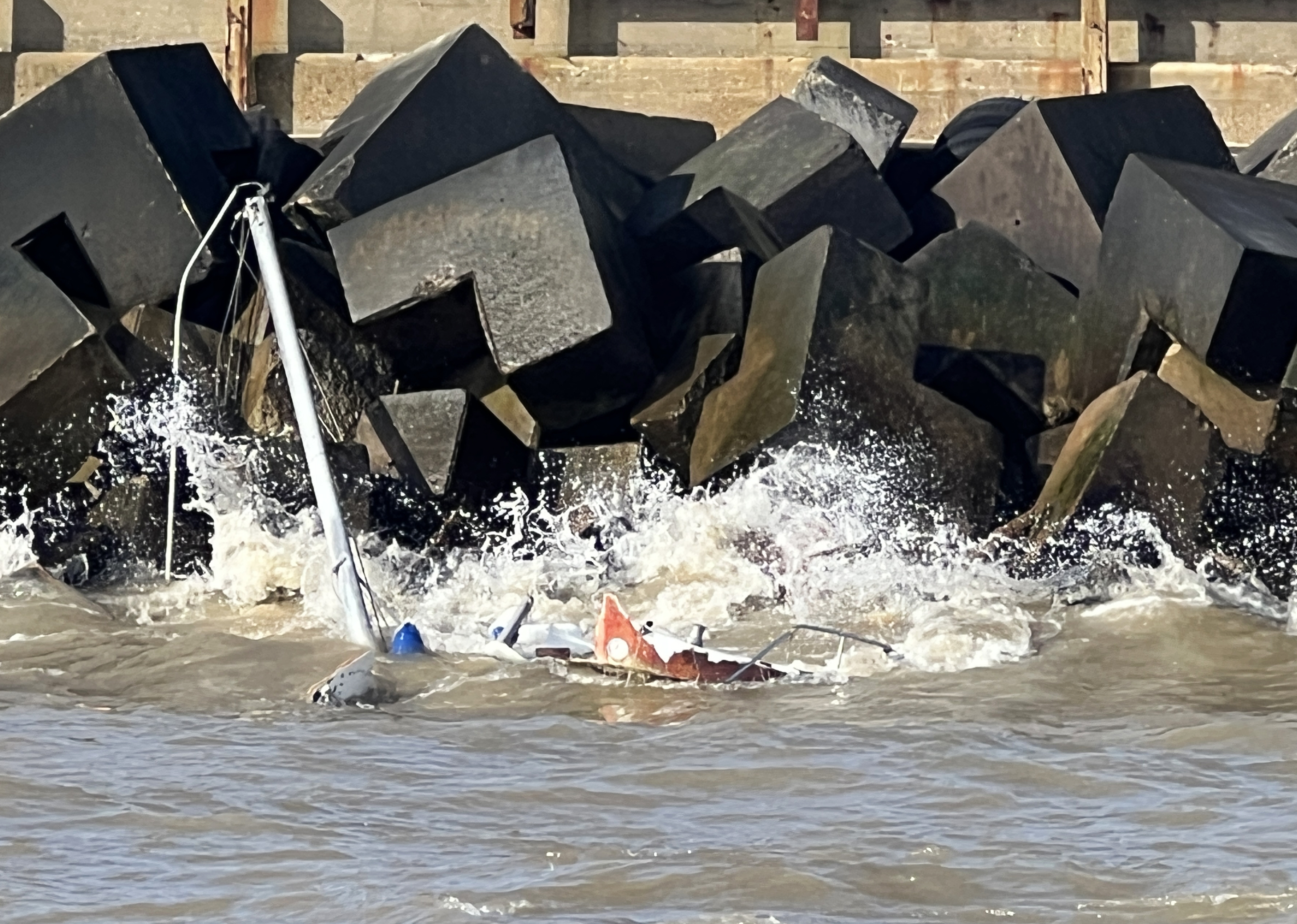 The stranded yacht being battered by the waves